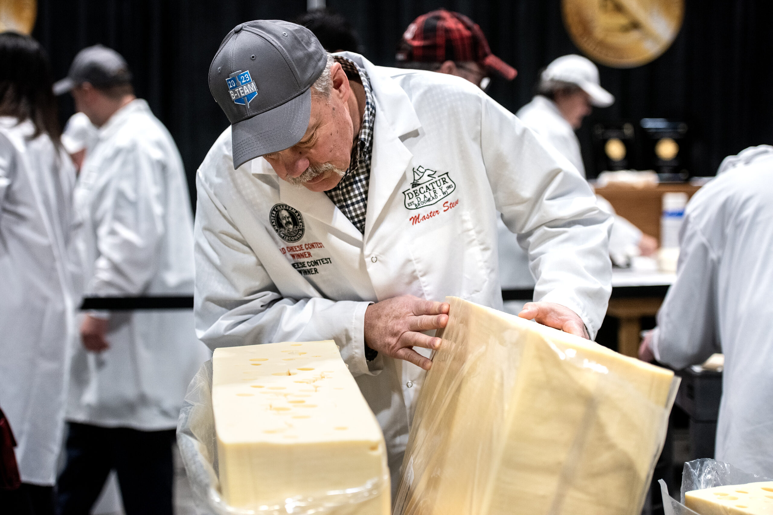 A large block of Swiss cheese is examined.