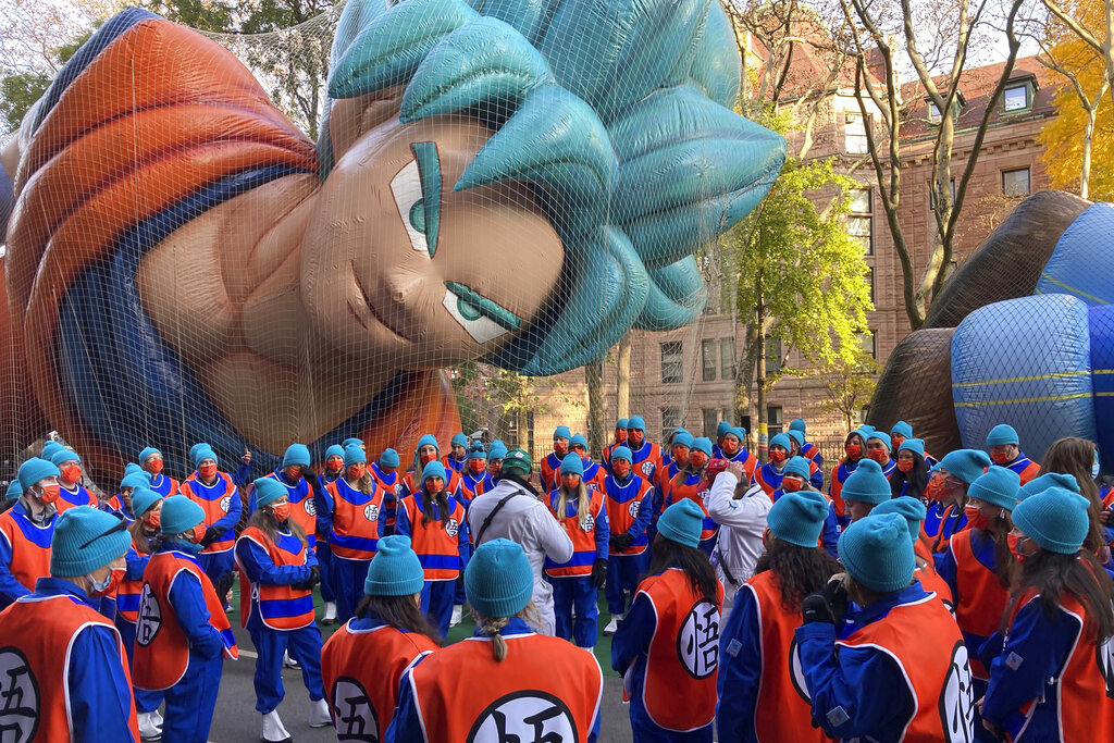 Handlers prepare to fly the Goku character helium balloon in New York City before the Macy's Thanksgiving Parade