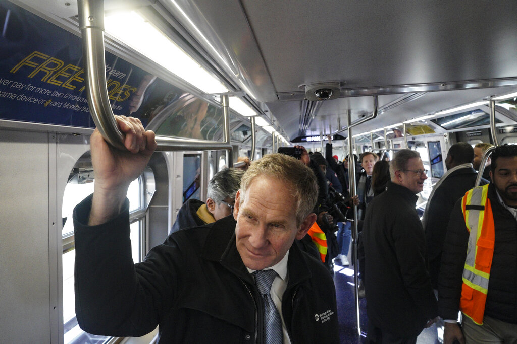 John Lieber, far left, chair and CEO of the New York City Metropolitan Transportation Authority, rides the MTA's newest subway train, Friday Feb. 3, 2023, in New York.