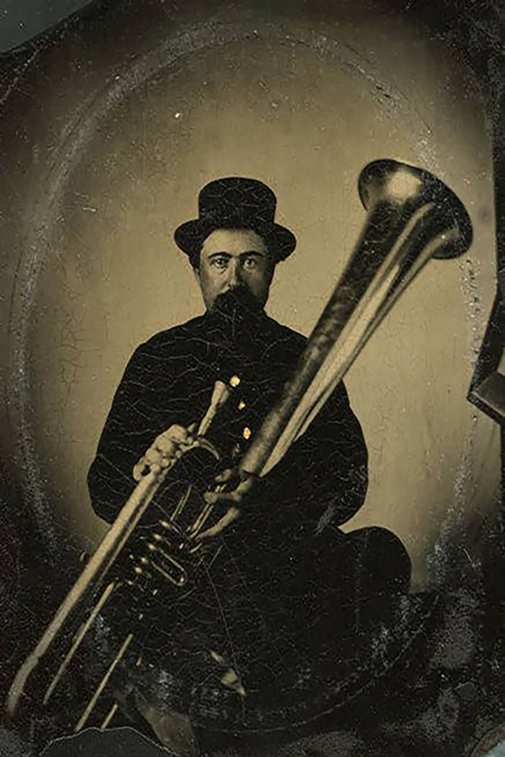 In this 1861 tintype portrait, Charles C. Stone of Brodhead, Wisconsin, holds a tuba.