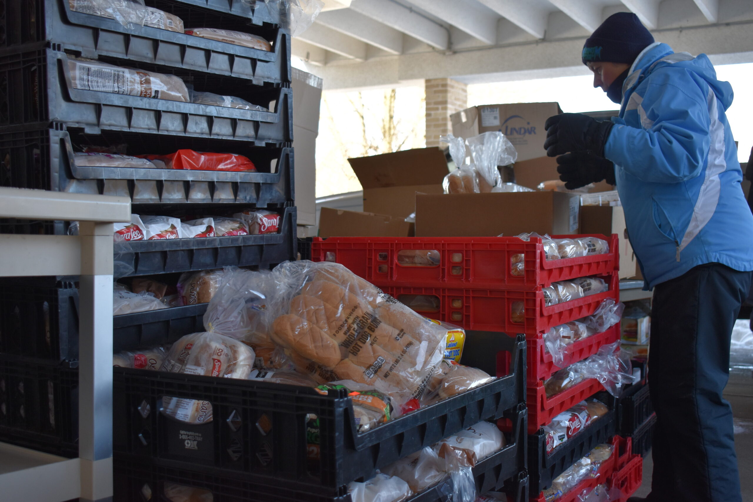 Volunteer Jean Jakel prepares food aid at the Abbotsford Area Collaborative Team food pantry at St. Bernard's Catholic Church in Abbotsford