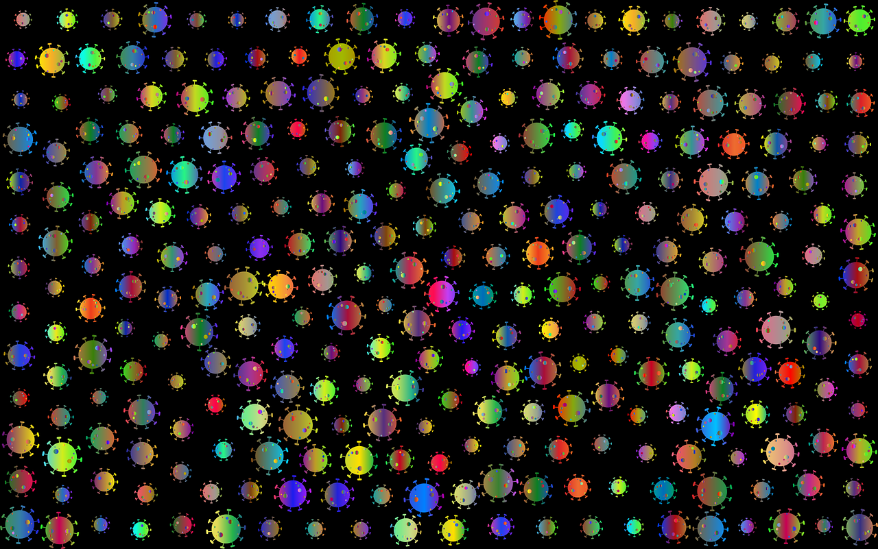 An illustration of a rainbow of microbes against a black background.