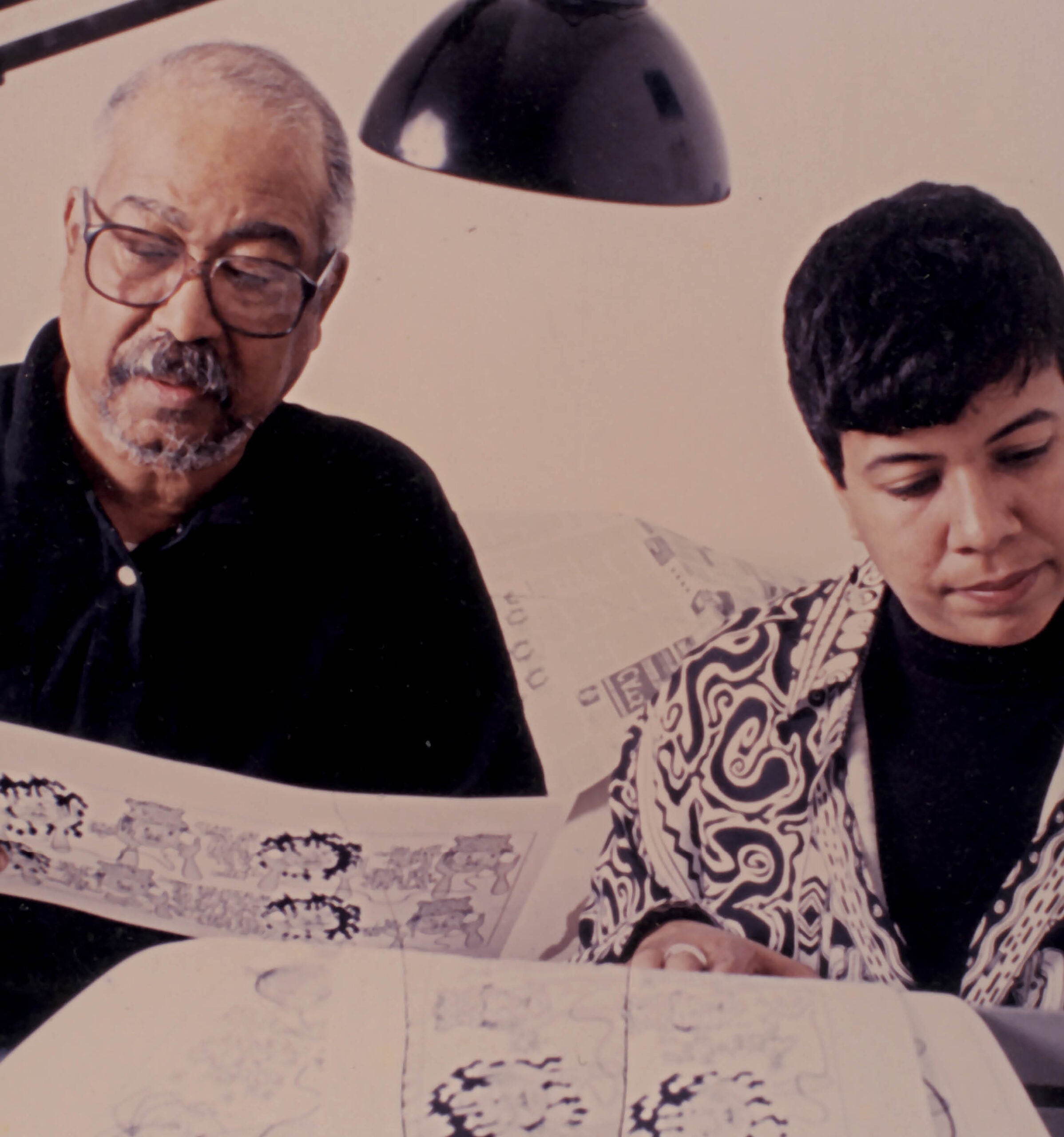 (L to R) Brumsic Brandon Jr and his daughter Barbara Brandon-Croft reviewing "Where I'm Coming From" strips