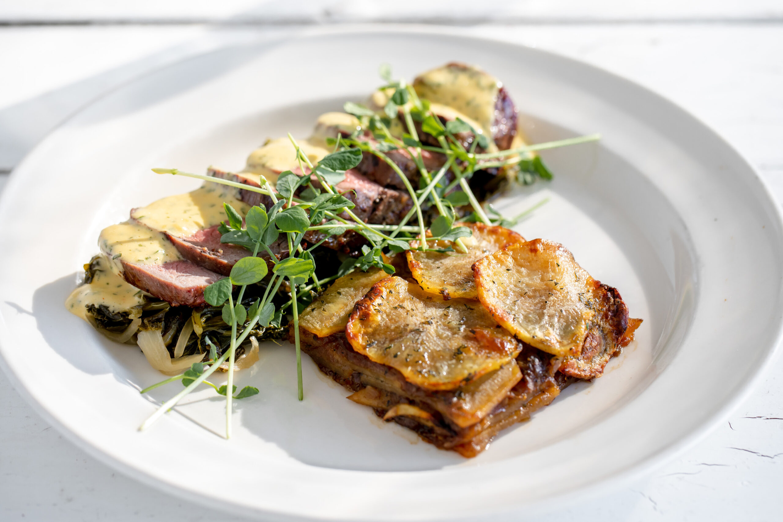 A Wickman House dish with potatoes, meat and microgreens.