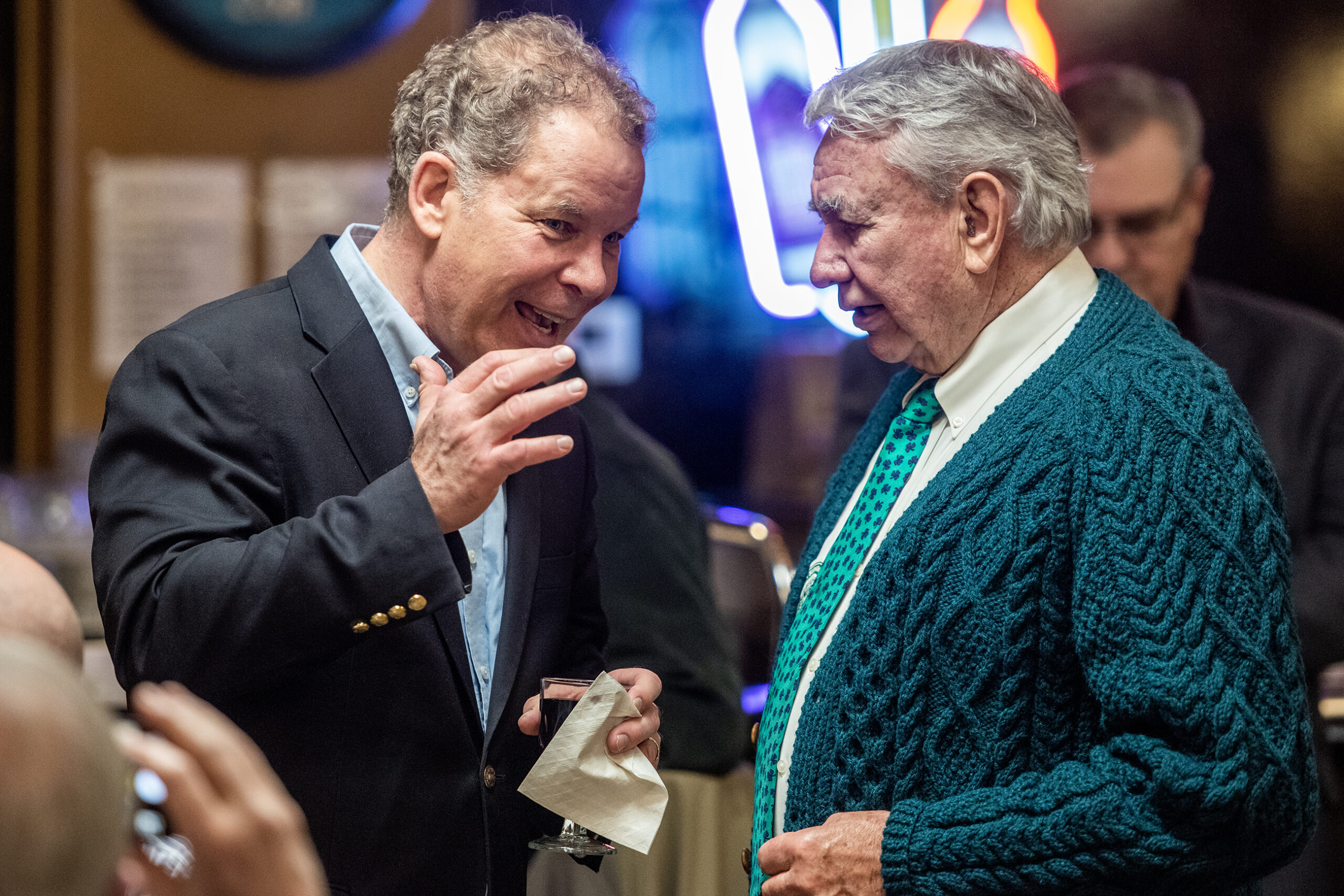 Dan Kelly speaks to Tommy Thompson in a supper club.