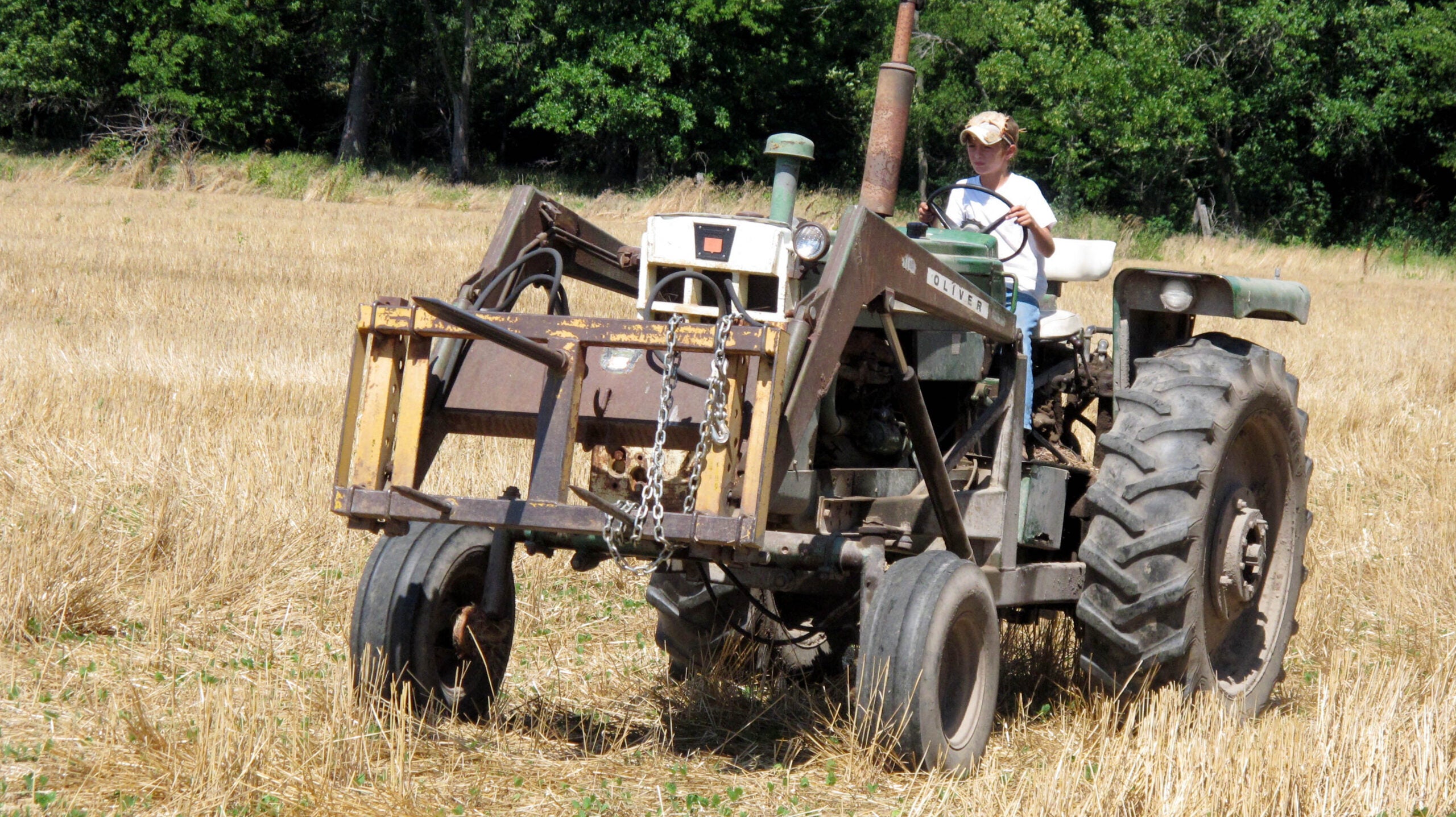 A child driving a tractor