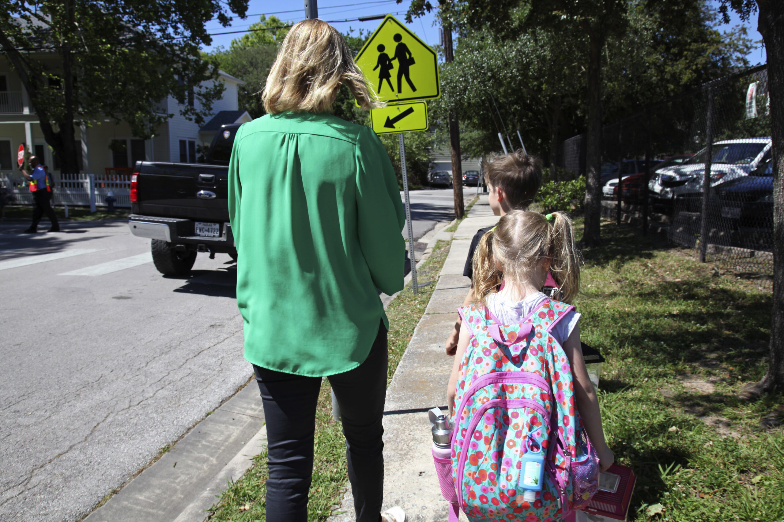Joanna Smith, of Houston, walks her twin first-graders home from school.
