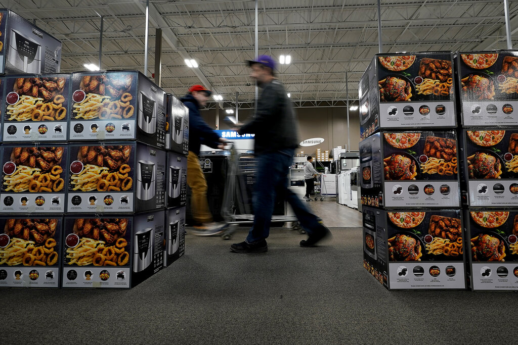 People pass a display of air fryers as they shop during a Black Friday sale at a Best Buy store Friday, Nov. 25, 2022, in Overland Park, Kansas.