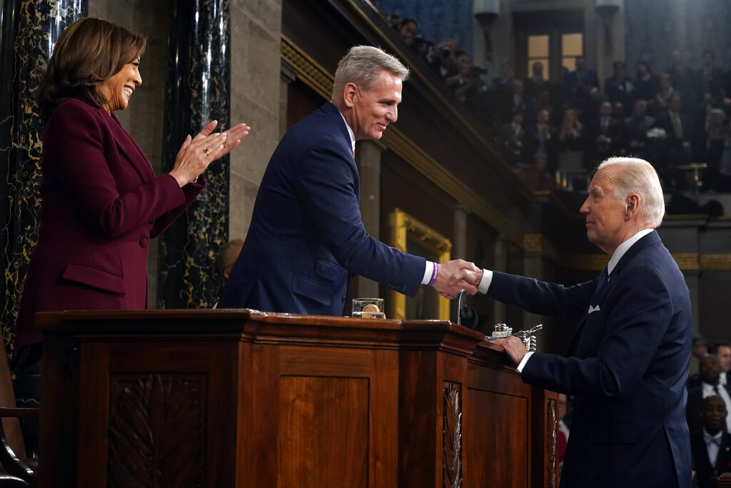President Joe Biden shakes hands with House Speaker Kevin McCarthy of Calif., as Vice President Kamala Harris watches after the State of the Union address to a joint session of Congress at the Capitol, Tuesday, Feb. 7, 2023, in Washington
