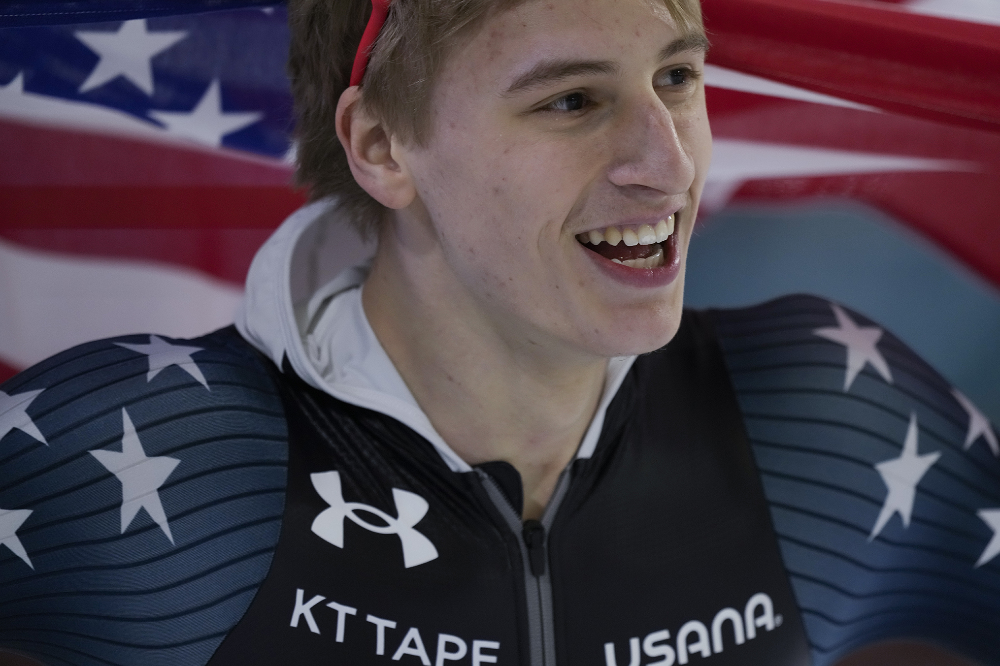 Jordan Stolz of the U.S. celebrates winning his third gold medal.
