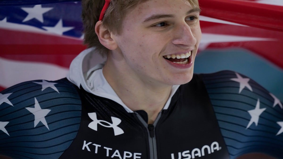 Jordan Stolz of the U.S. celebrates winning his third gold medal.