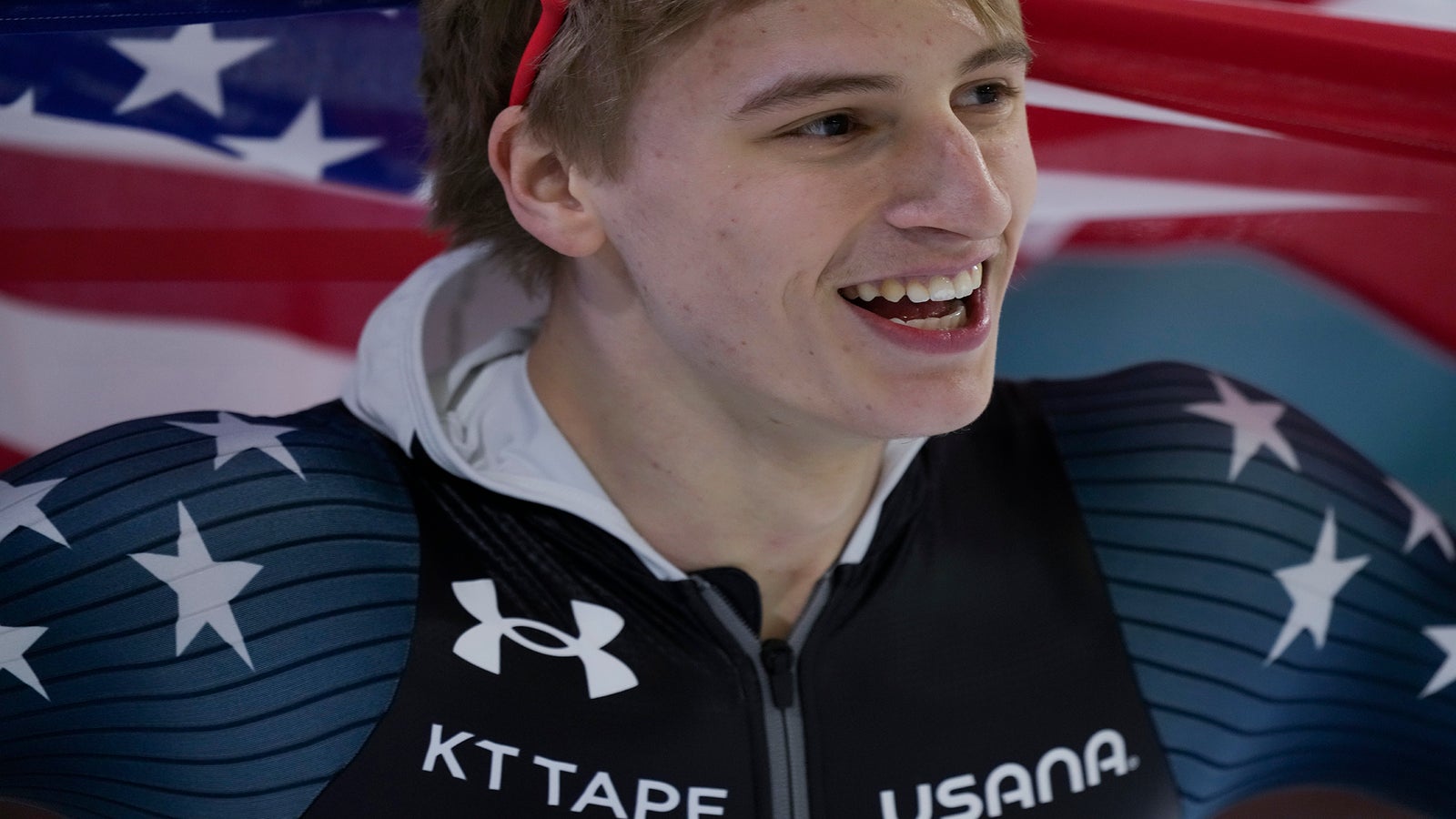 Jordan Stolz of the U.S. celebrates winning his third gold medal.