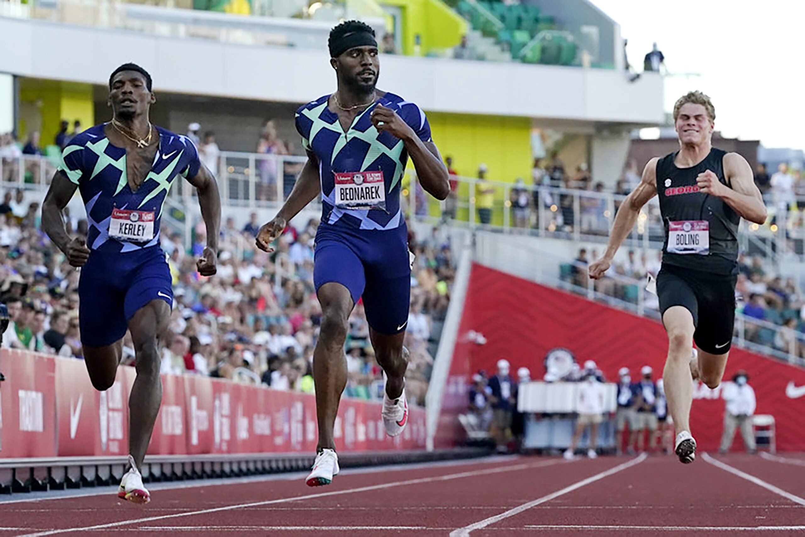 Three men race in a 200-meter dash