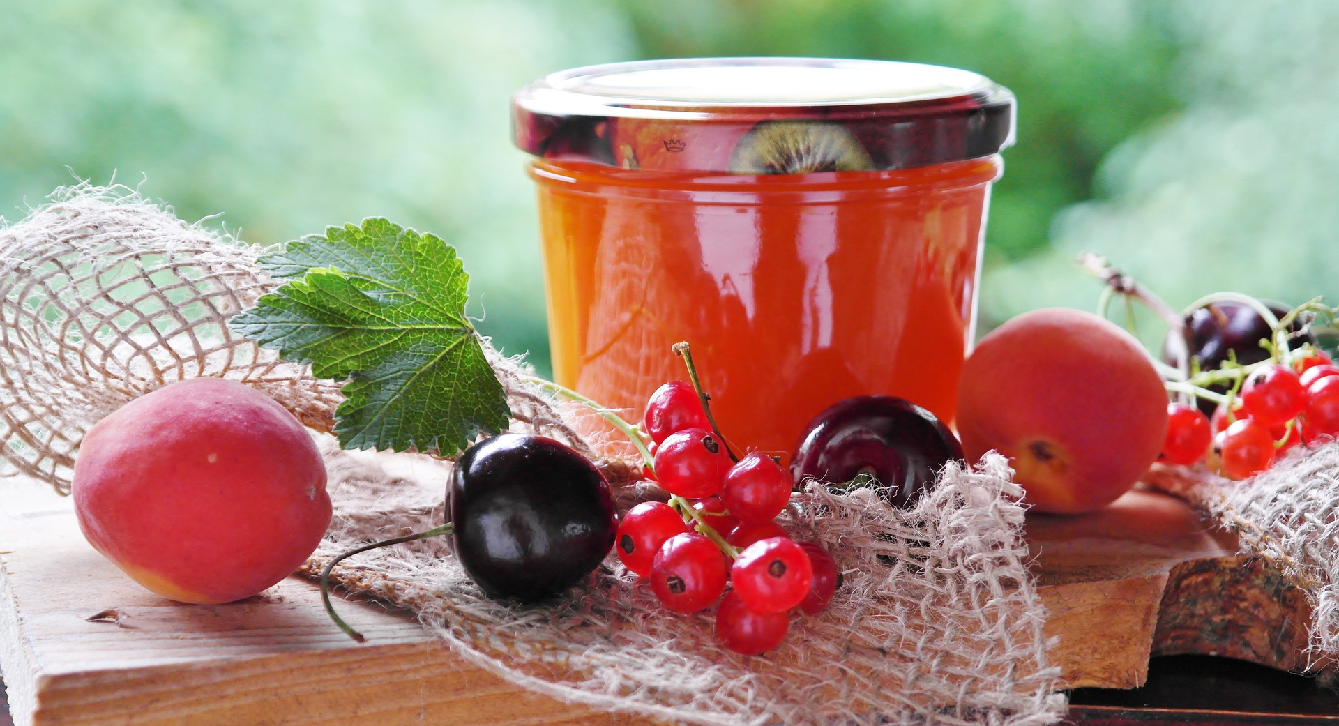 Jam jar with fruit .