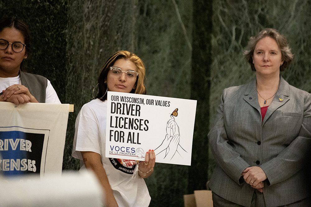 Stephanie Janeth Salgado Altamirano is seen alongside Madison Mayor Satya Rhodes-Conway at a press event