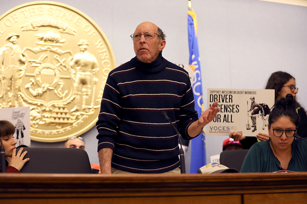 Michael Slattery speaks at a rally in Madison, Wisconsin