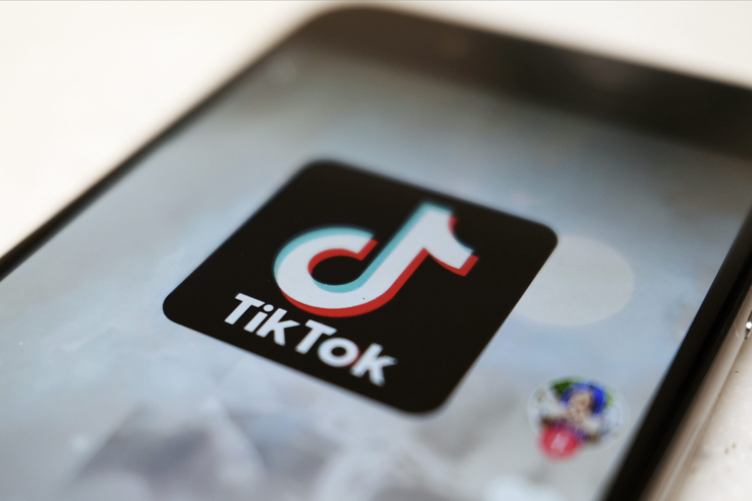 The TikTok logo on a smartphone