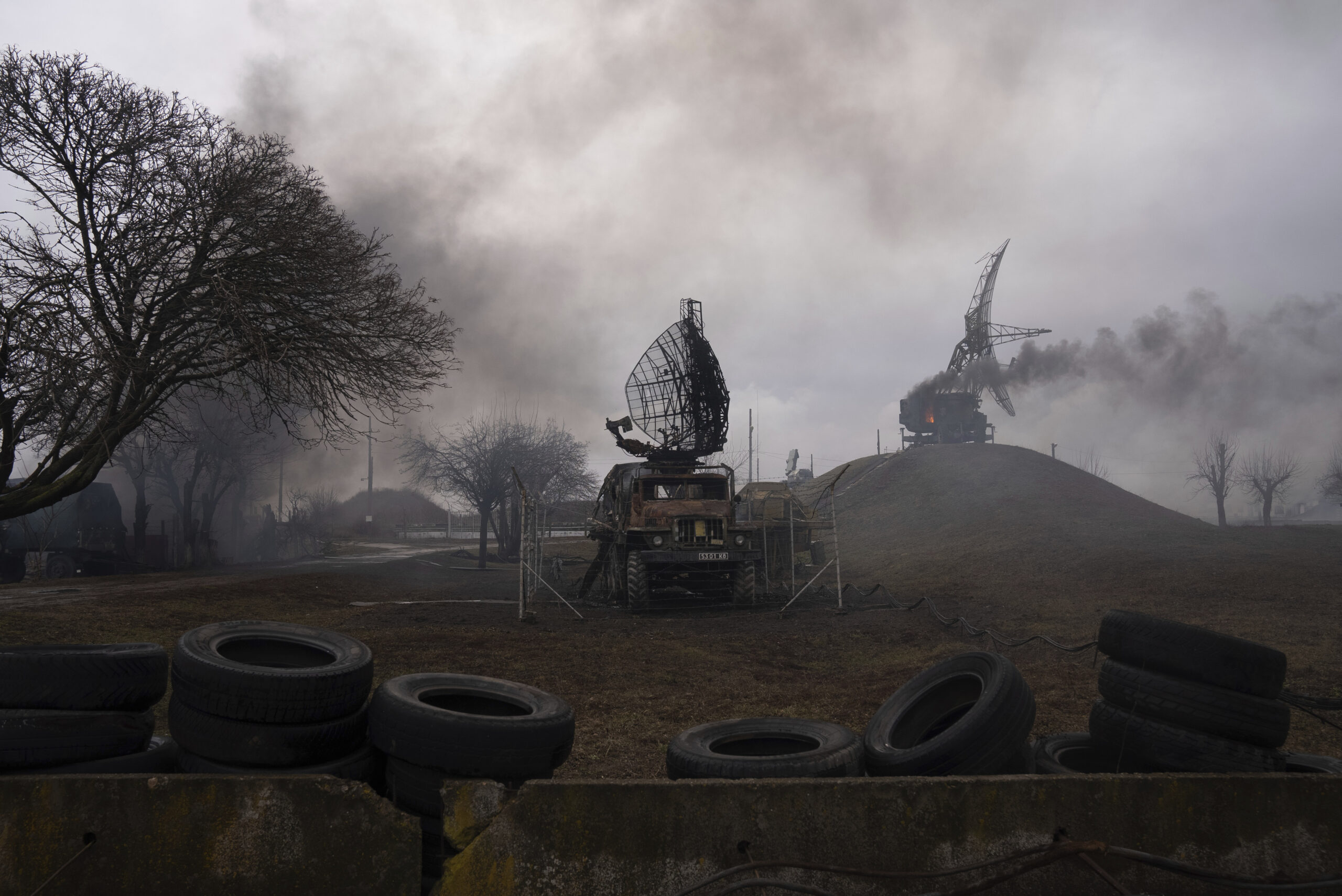 Smoke rises from an air defense base in the aftermath of an apparent Russian strike in Mariupol, Ukraine