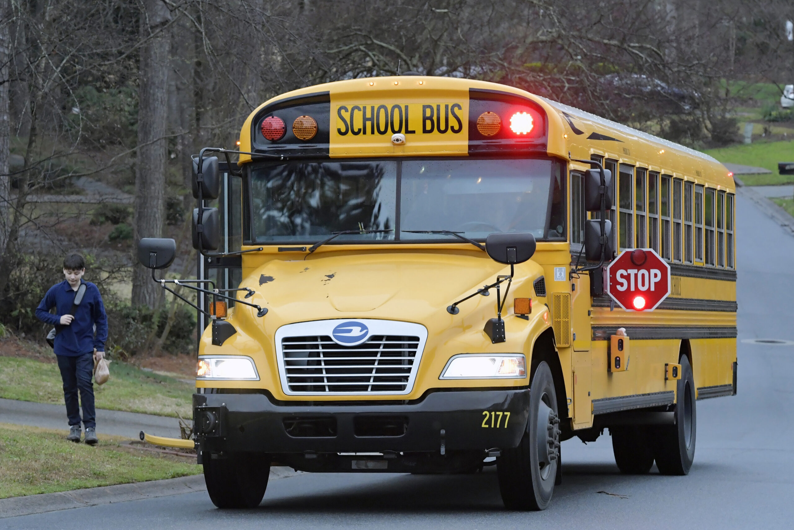 A Cobb County School bus moves on street.