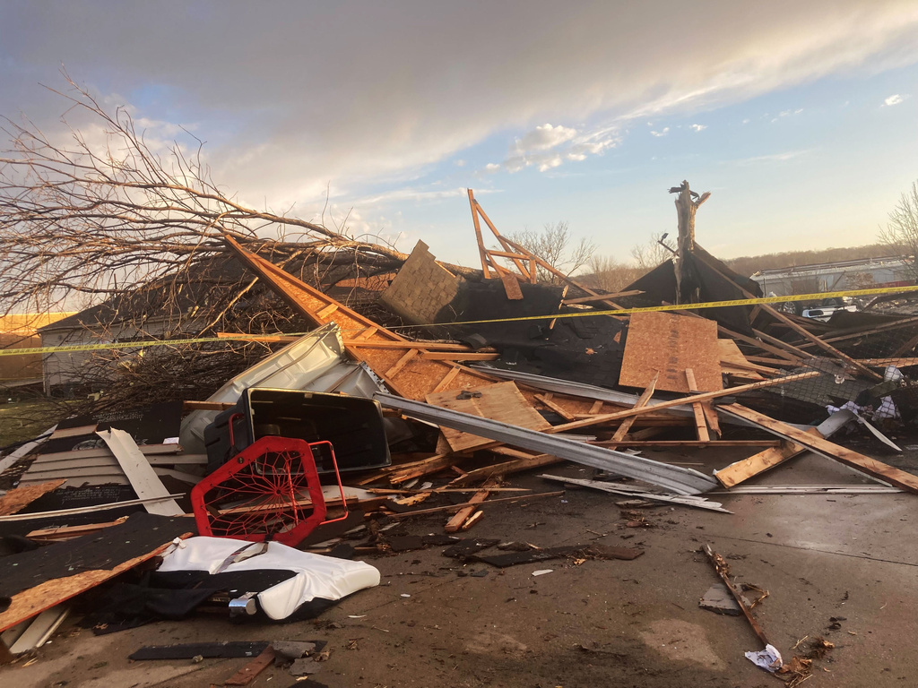 Homes are damaged after a tornado swept through Coralville, Iowa, Friday, March 31, 2023.