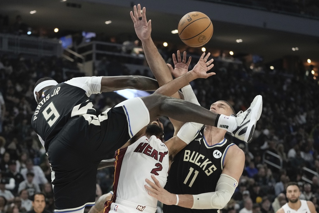 Milwaukee Bucks' Bobby Portis fouls Miami Heat's Gabe Vincent during the first half in Game 1 of an NBA basketball first-round playoff game