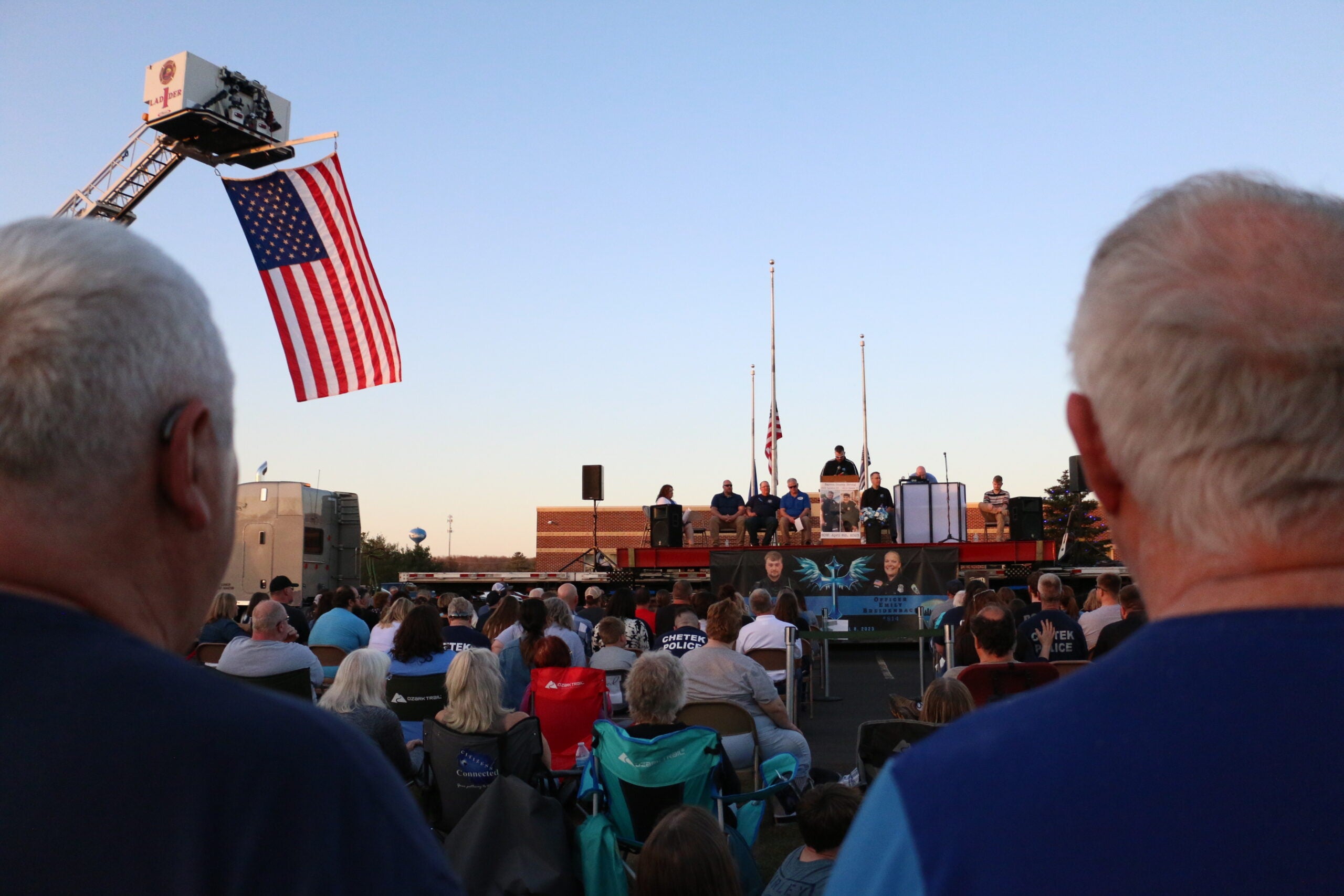 Attendees of the candlelight vigil Wednesday in Cameron mourned officers killed in a traffic stop on Saturday.