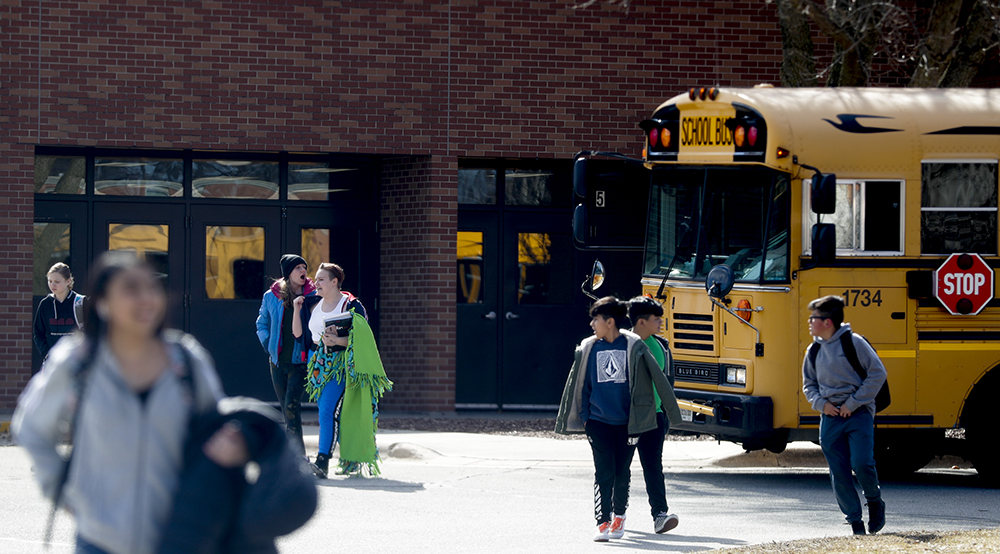 Franklin Middle School students exit the building after being dismissed on Friday, March 13, 2020, at Franklin Middle School in Green Bay