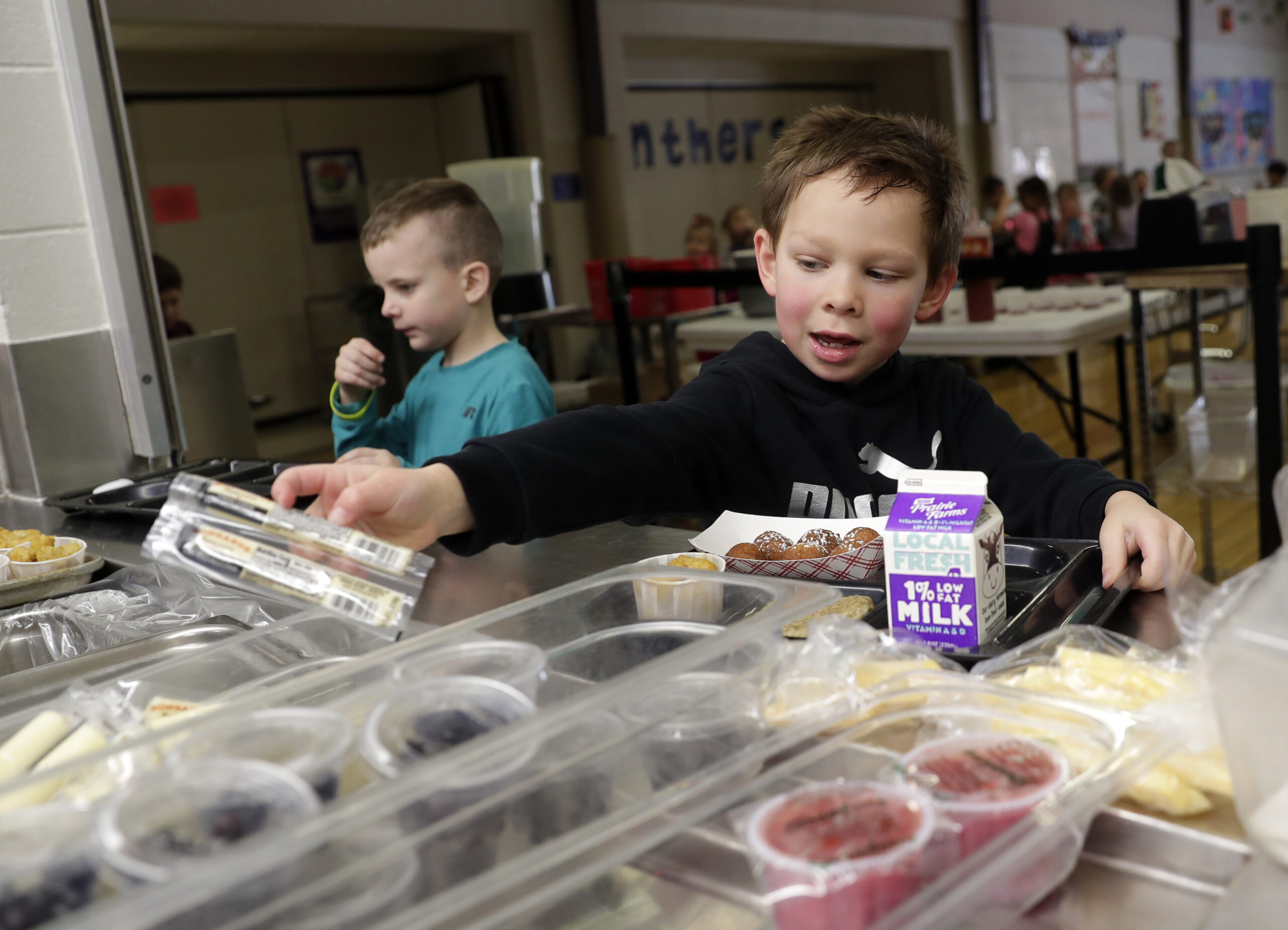 Kindergarten students at Suamico Elementary School go through the hot lunch line