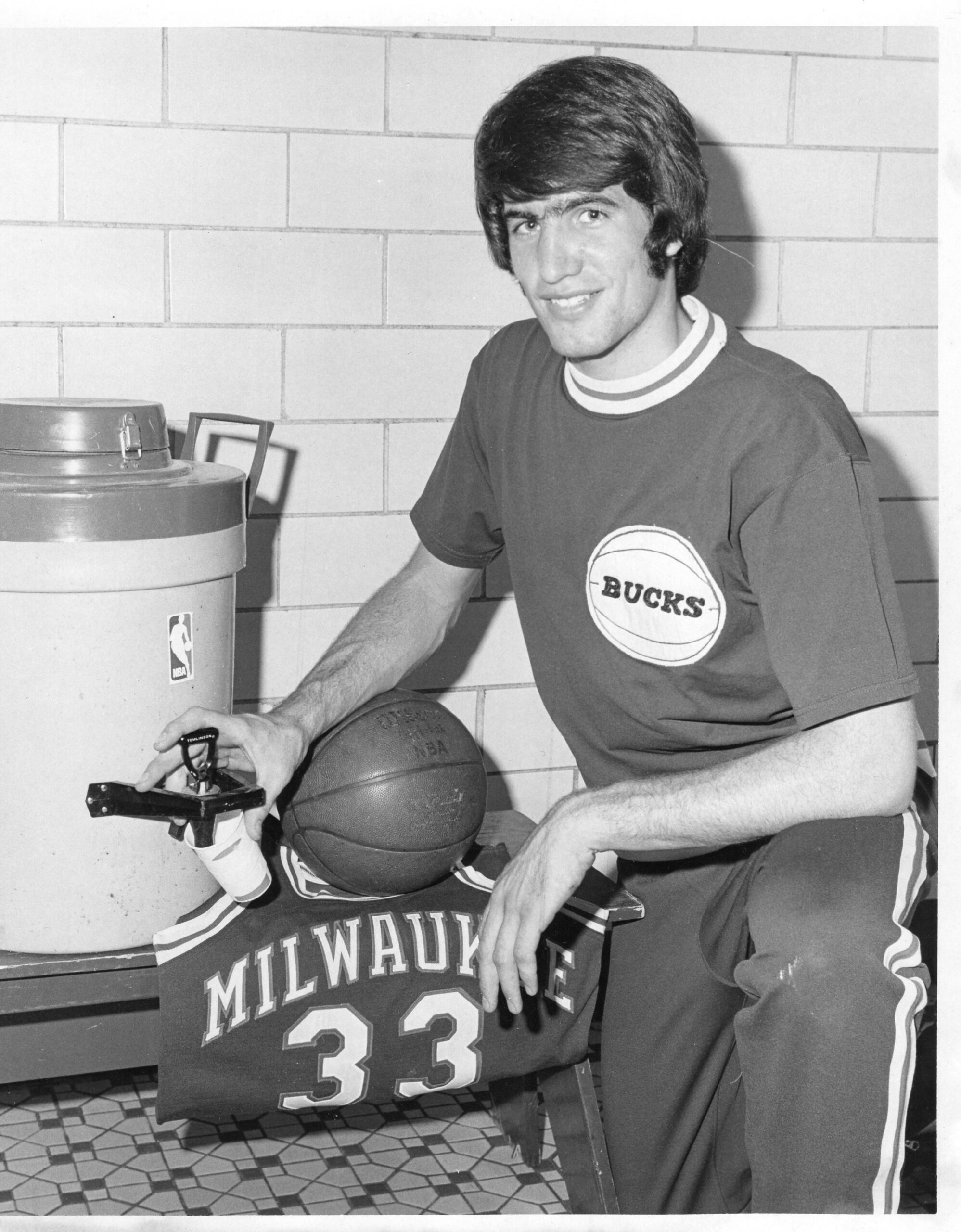 Patrick McBride poses with Milwaukee Bucks gear