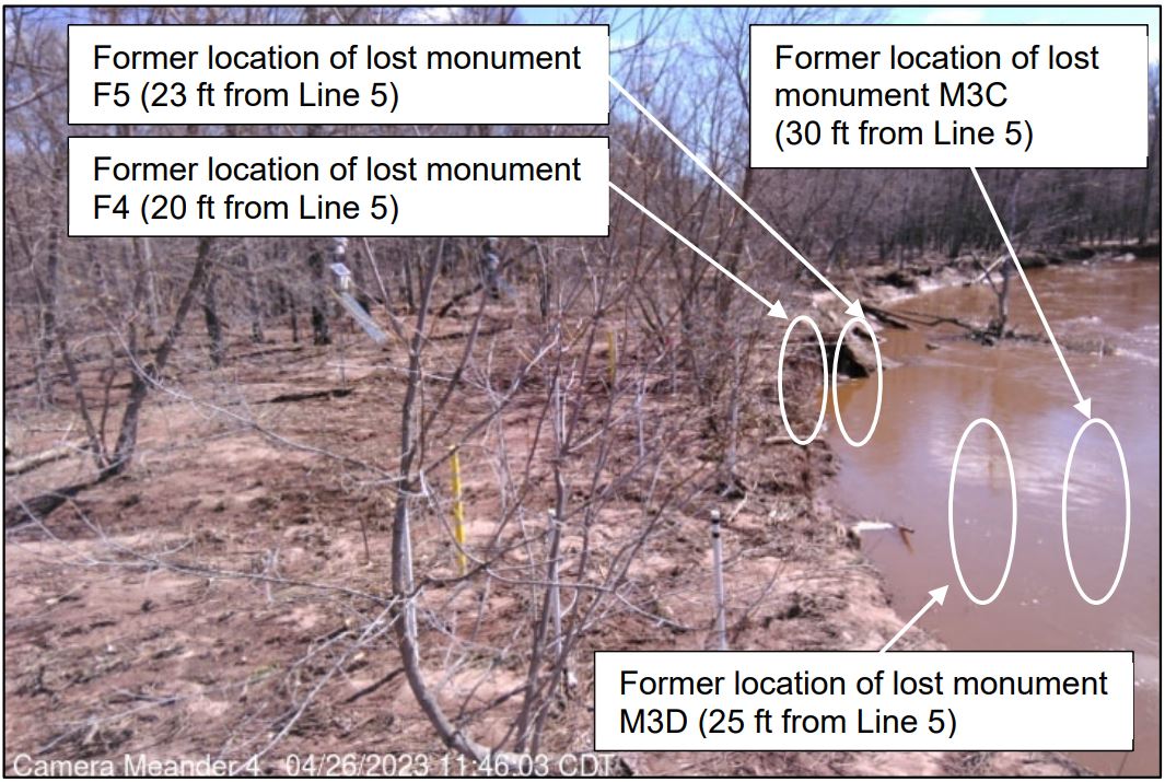 Bank erosion near posts marking distance to Line 5