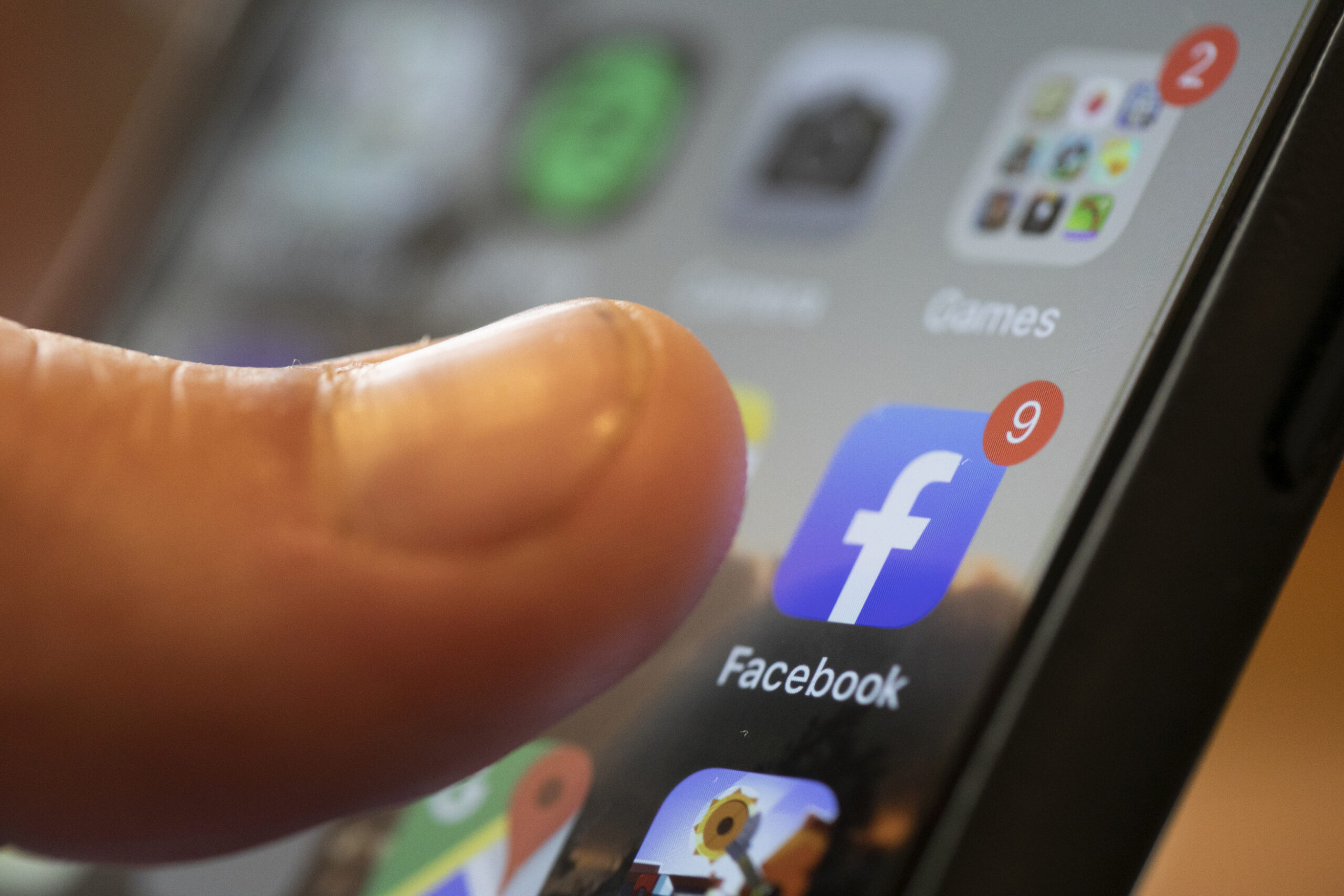 An iPhone displays the Facebook app