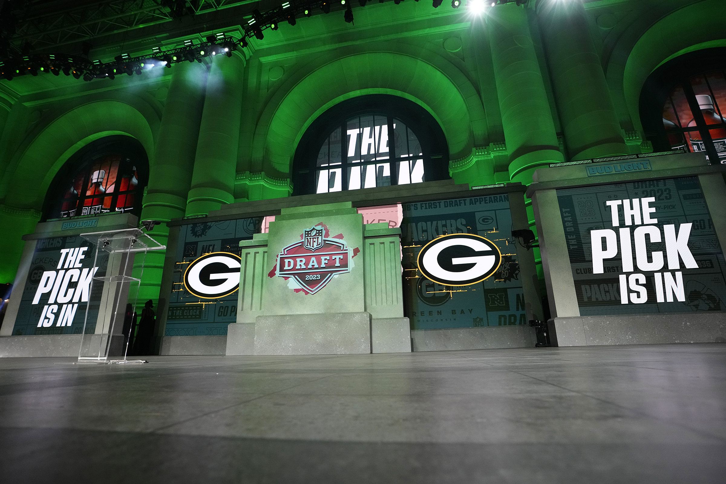 The onstage video screens display "The Pick Is In" for the Green Bay Packers during the 2023 NFL Draft