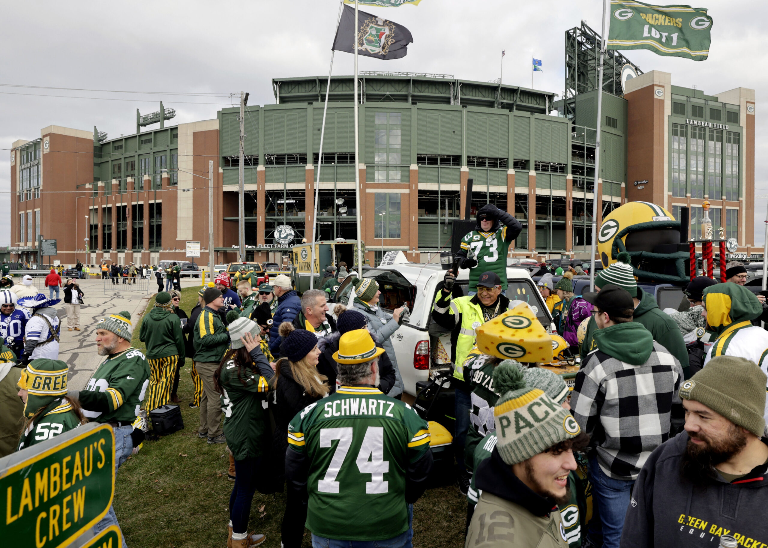 Green Bay Packer fans tailgate outside Lambeau Field.