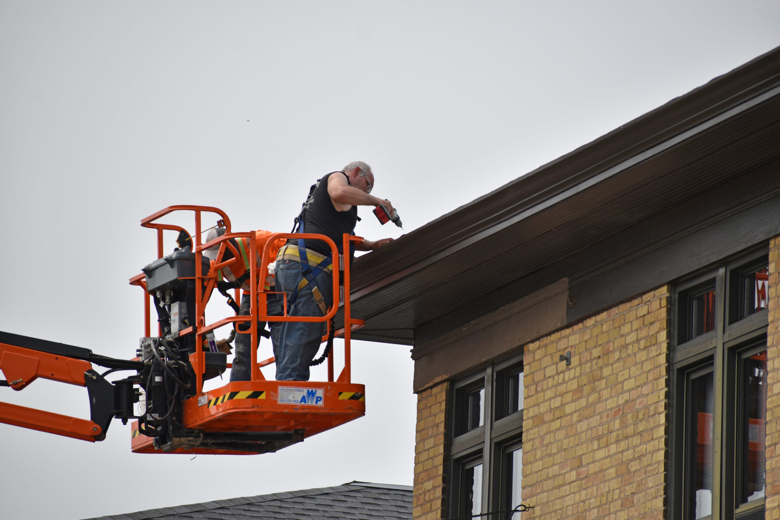 Contractors work on the exterior of the former Smith Elementary School in Oshkosh.