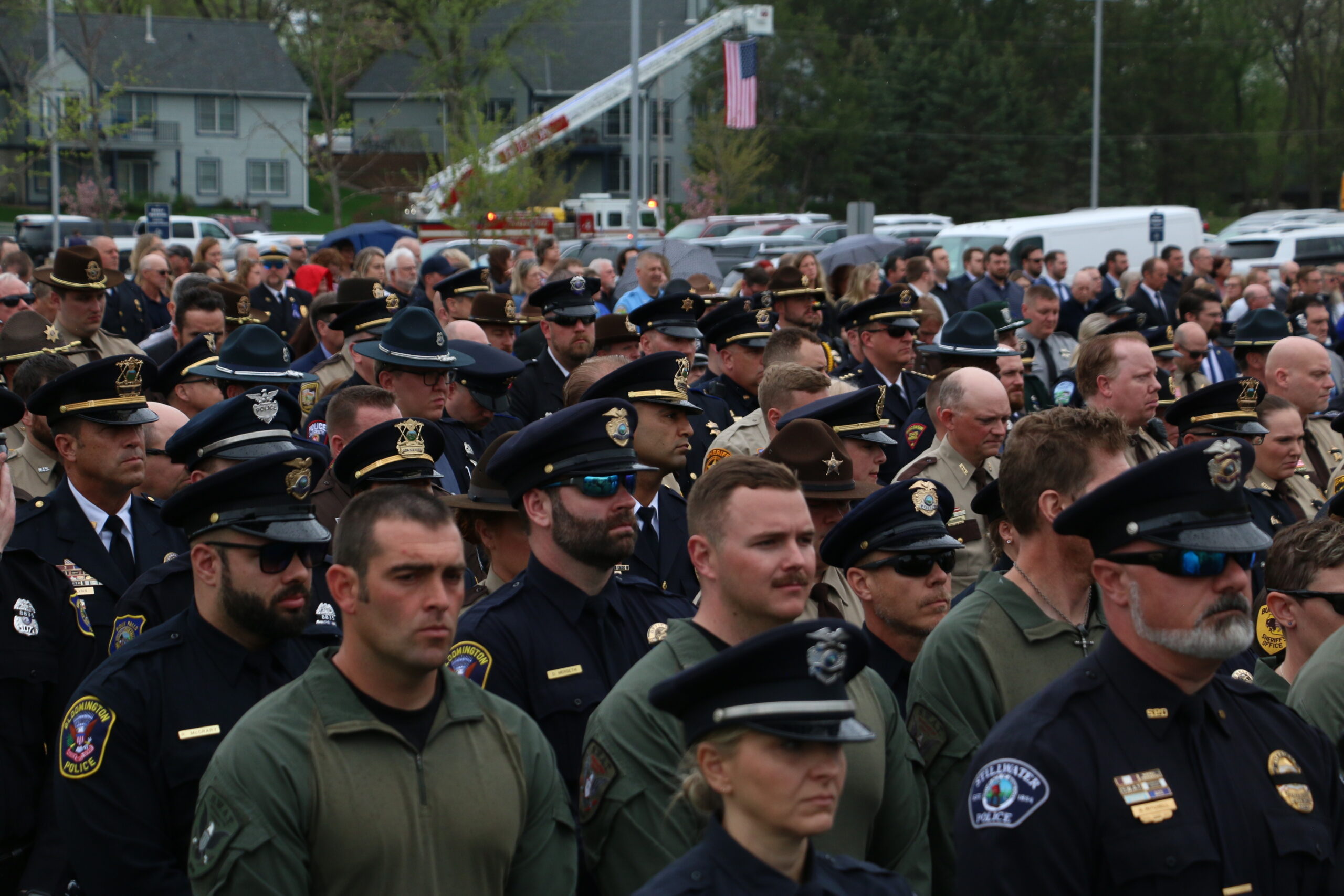 Members of law enforcement look on during funeral honors for St. Croix County Sheriff's Deputy Kaitie Leising, who was killed in the line of duty.