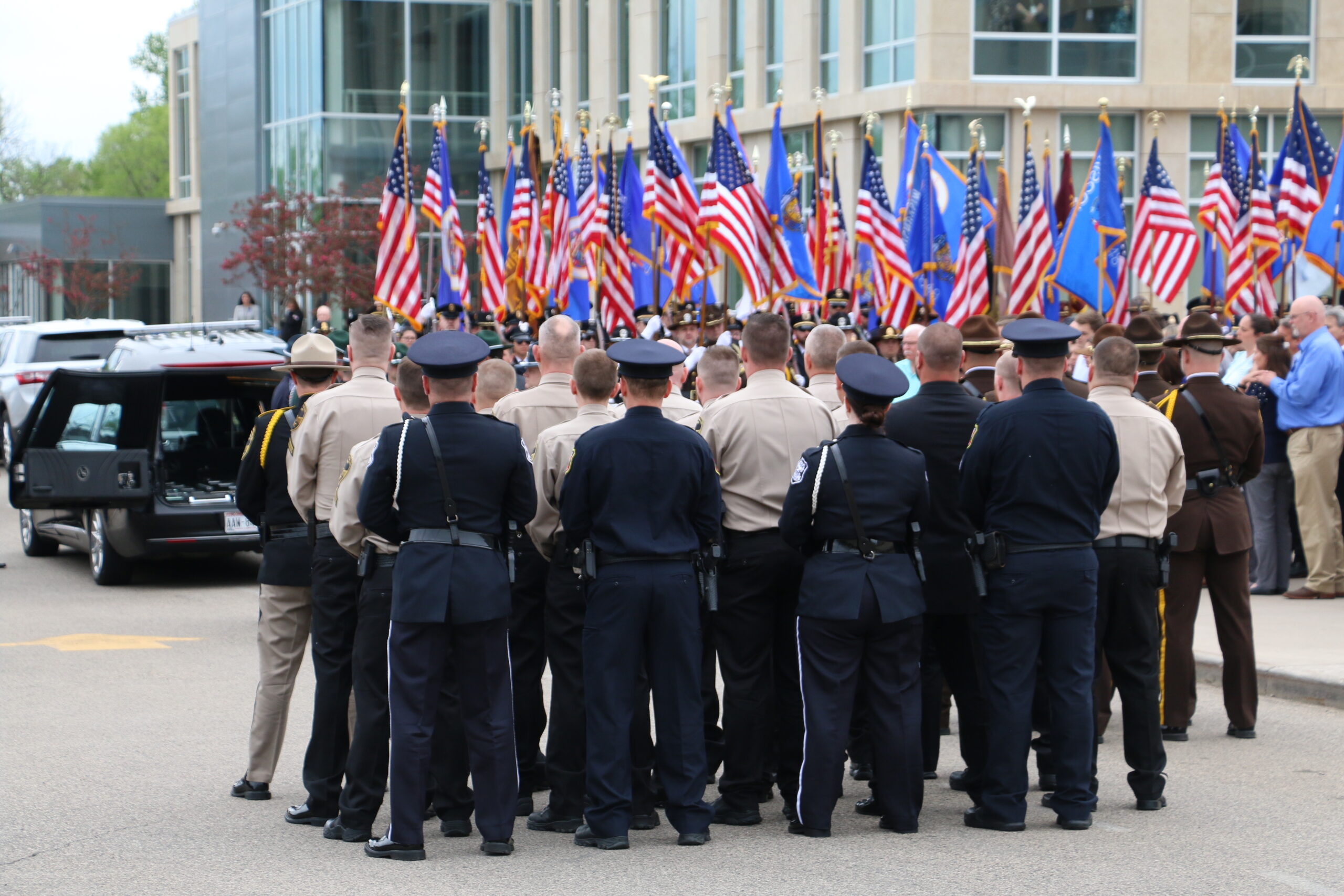 Law enforcement officers pay their respects at the funeral of St. Croix County Sheriff's Deputy Kaitie Leising
