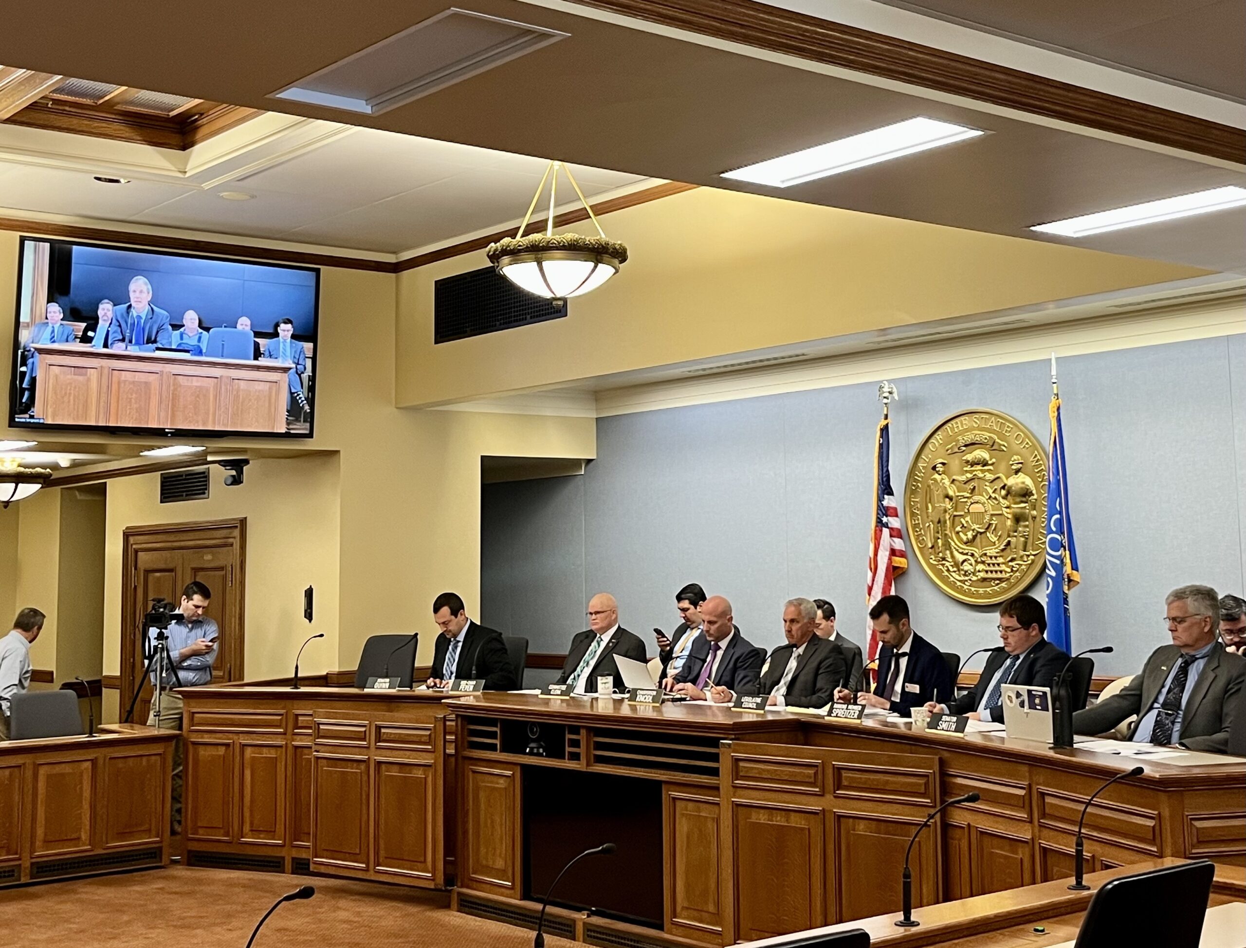 Members of the Wisconsin Senate Committee on Shared Revenue, Elections and Consumer Protection hear testimony from William Jones, Mequon's city administrator