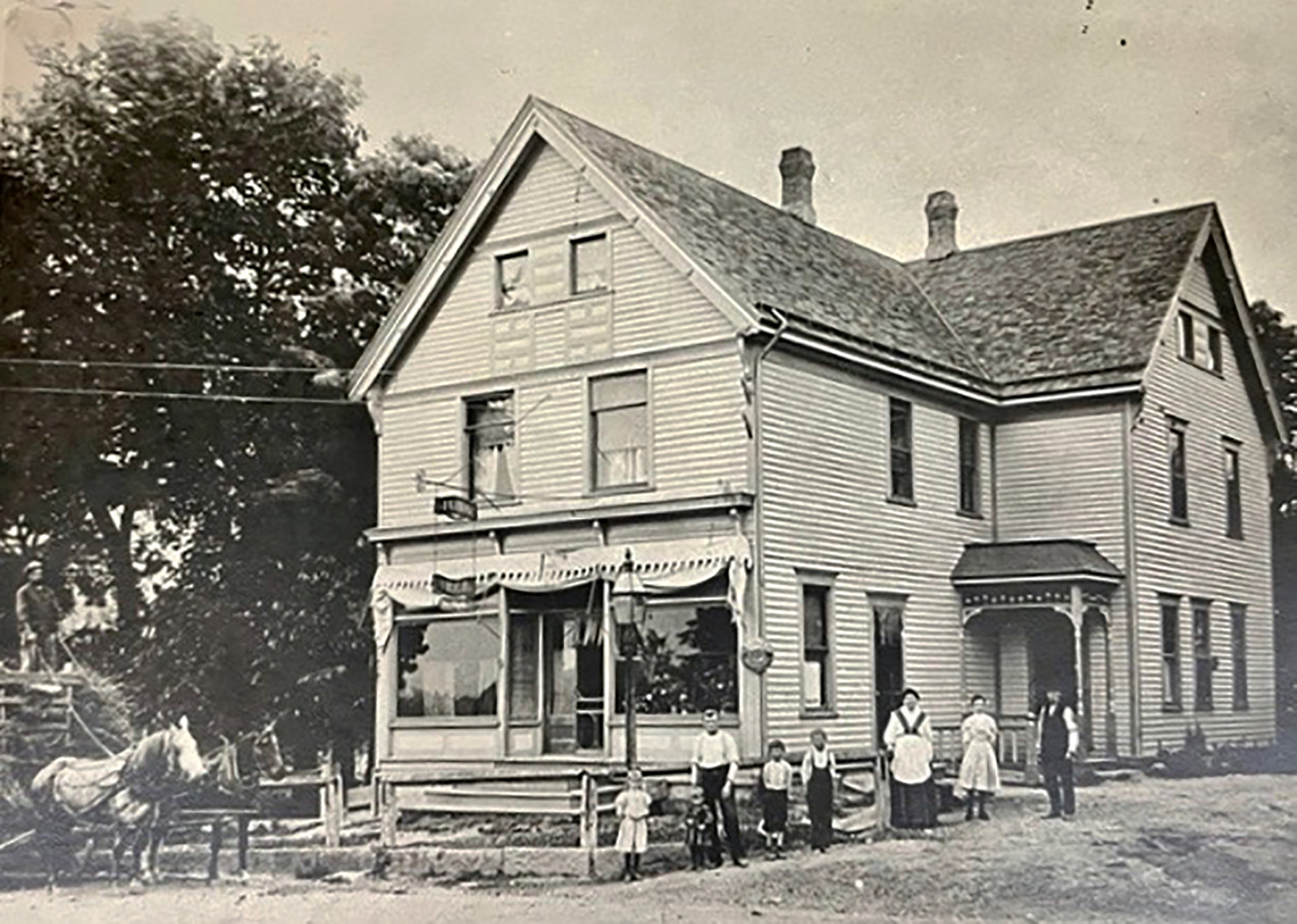 The Brueggemann family, German immigrants to Wisconsin, in front of their tavern in the 1900s.