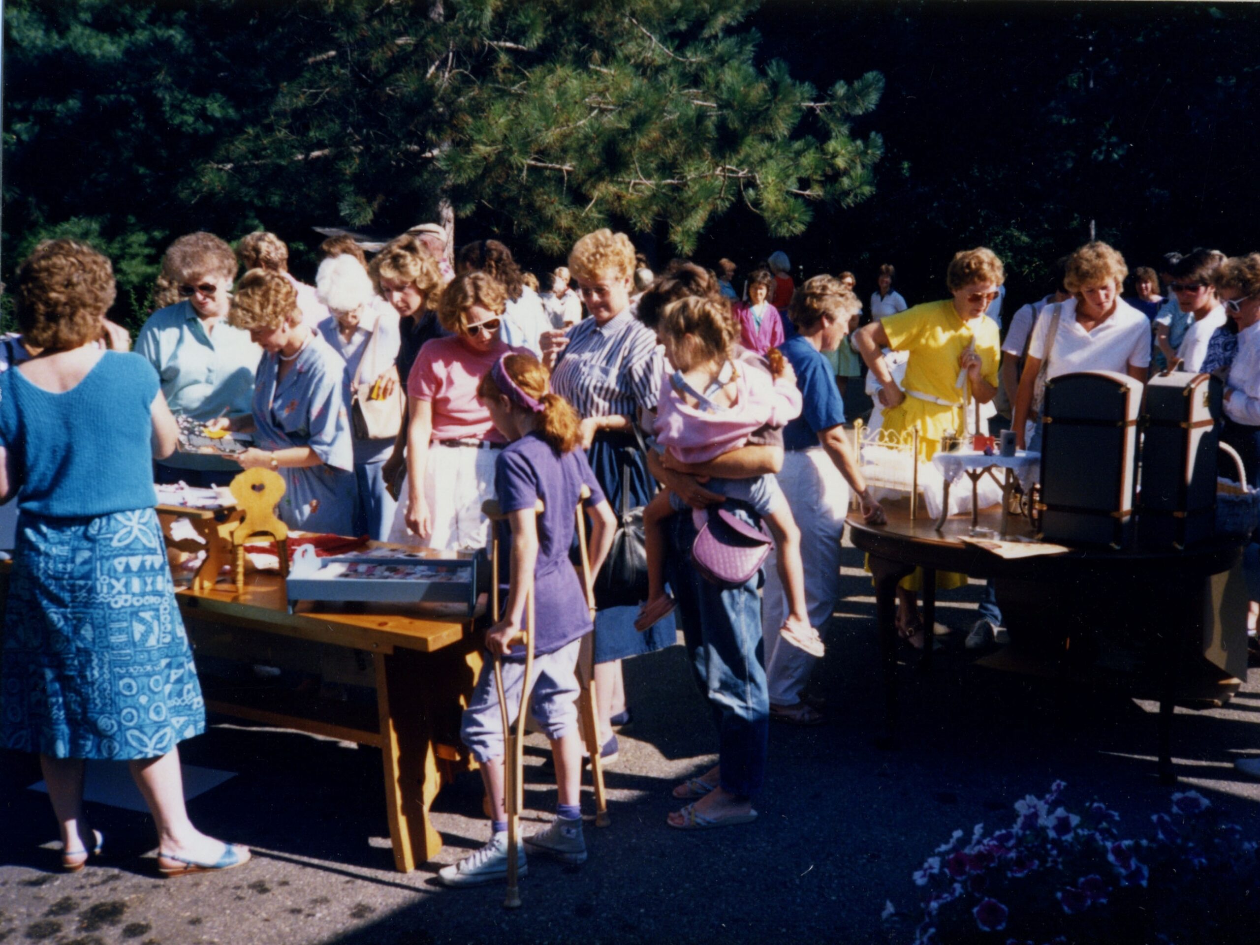 Shoppers in 1998 pursue donated American Girl merchandise.