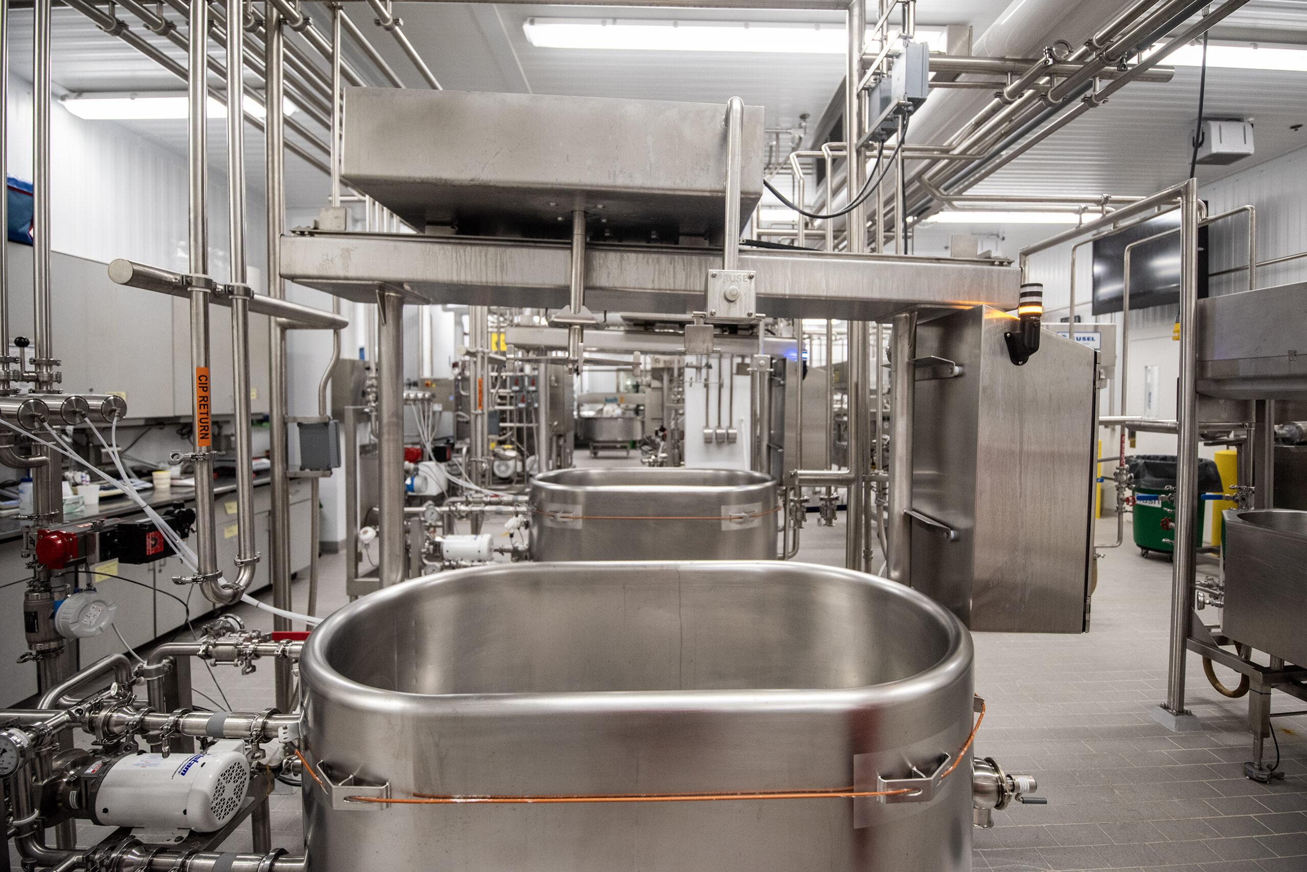 Stainless steel machinery fills a room.