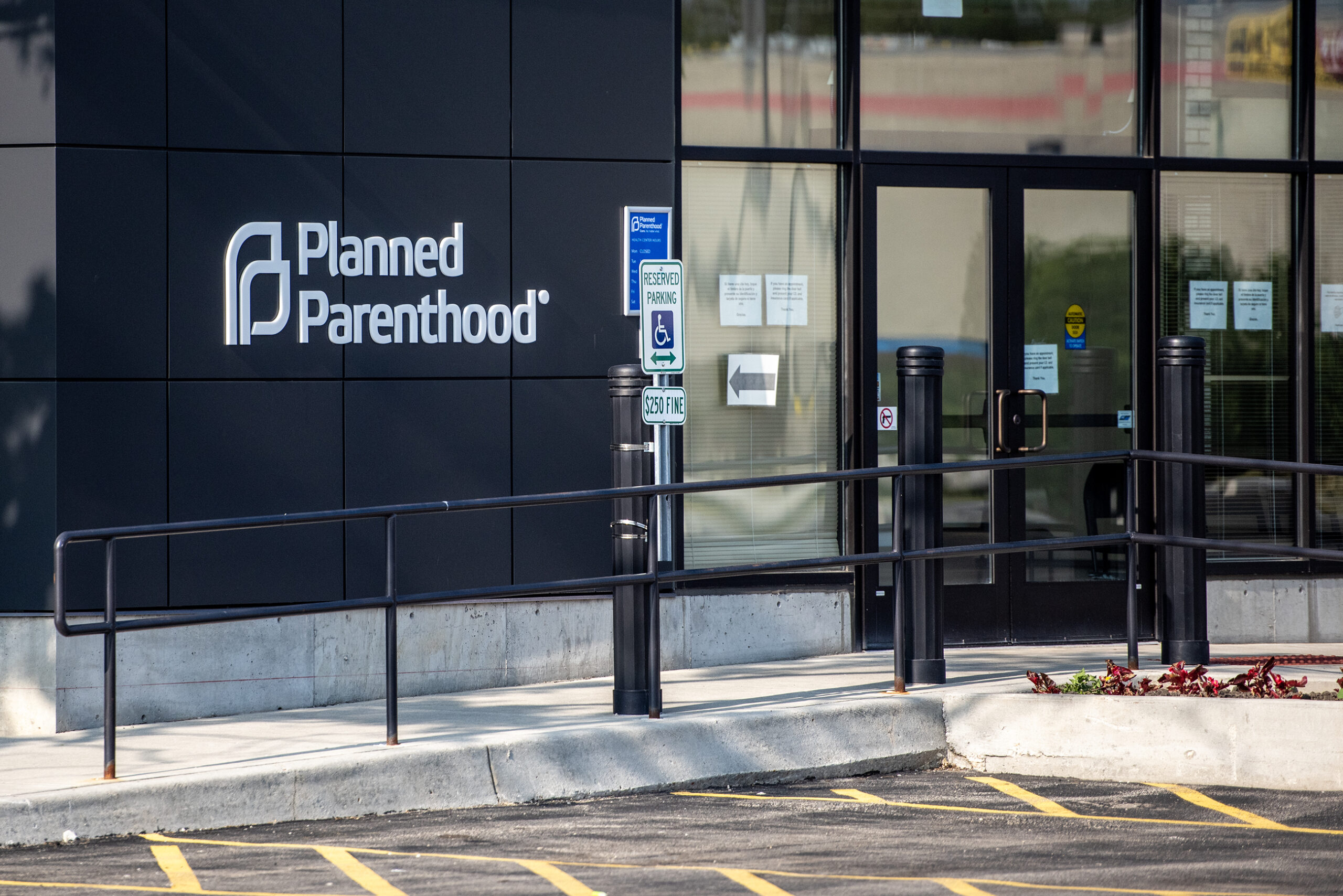 A Planned Parenthood sign is displayed on the exterior of a building.