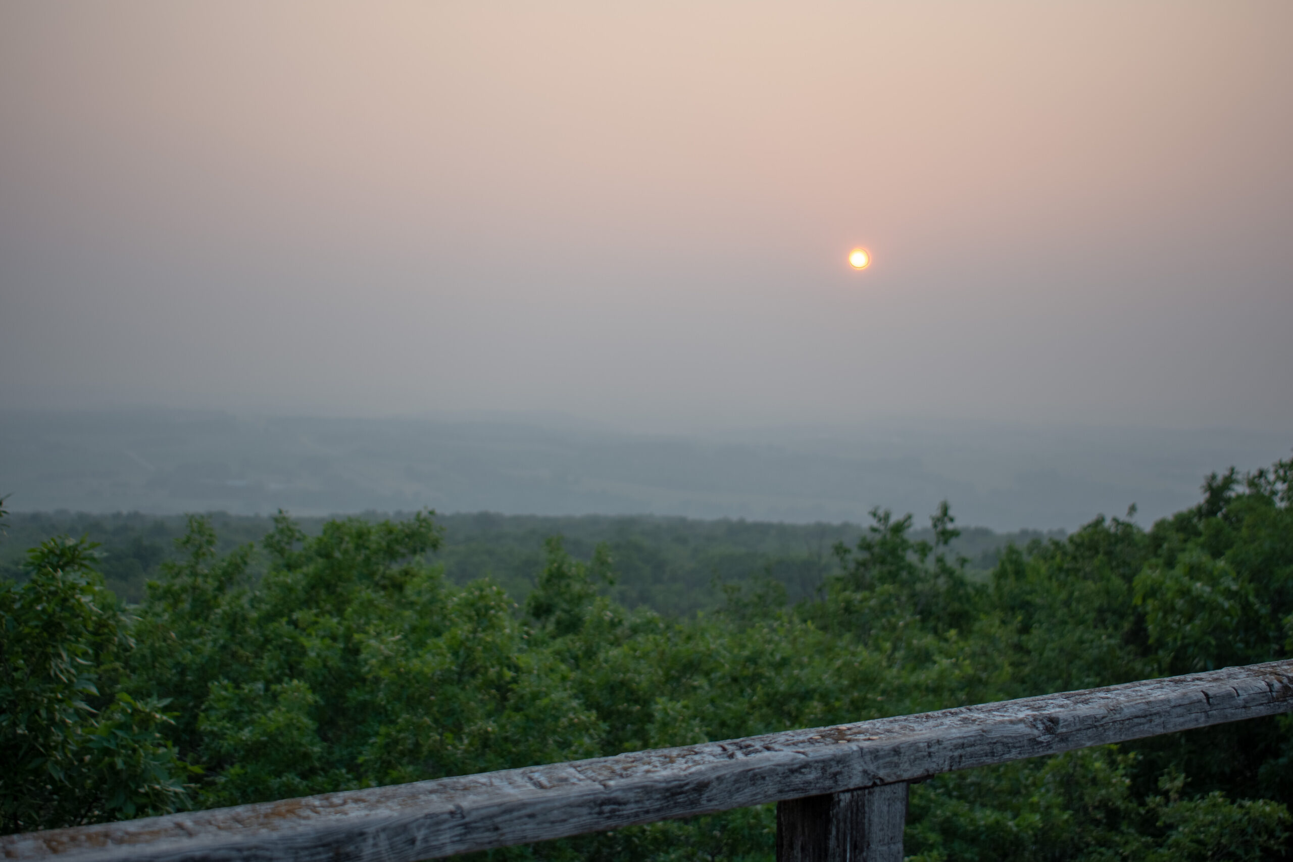 Haze from Canadian wildfires is seen at an overlook at Blue Mounds State Park.