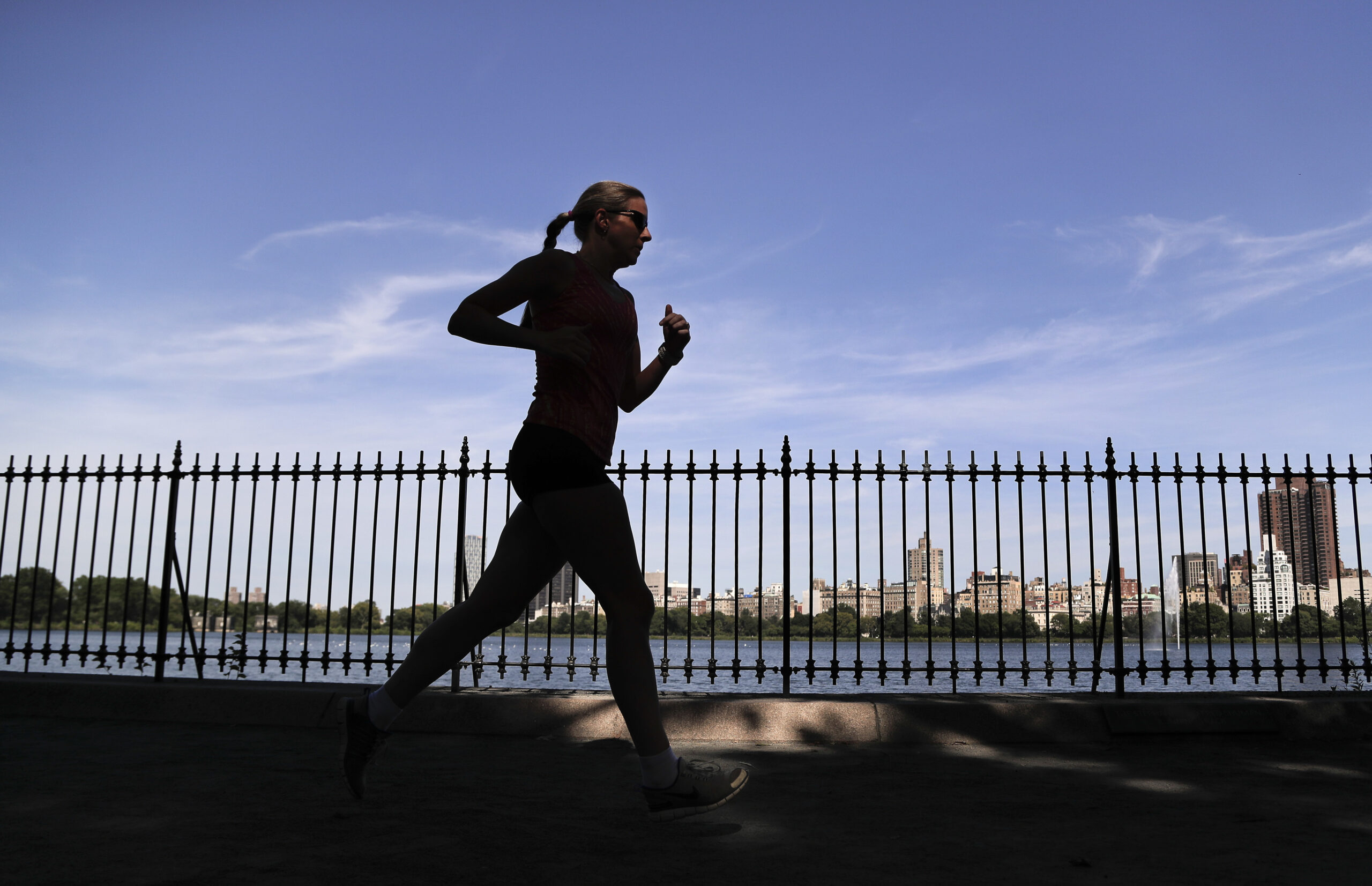 A woman jogs through Central Park
