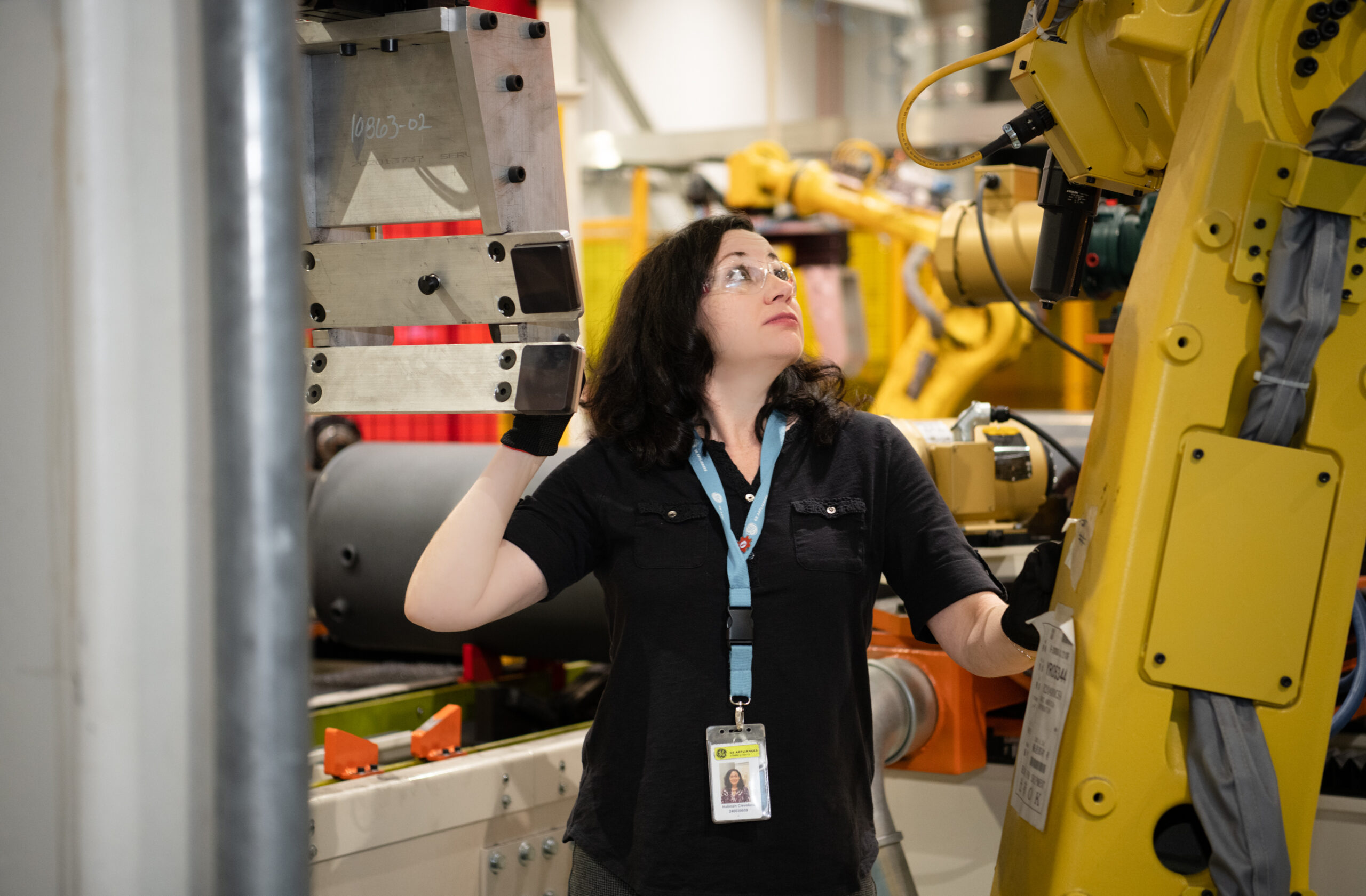 Halimah Cleveland inspects the cooling line on new robotic equipment.