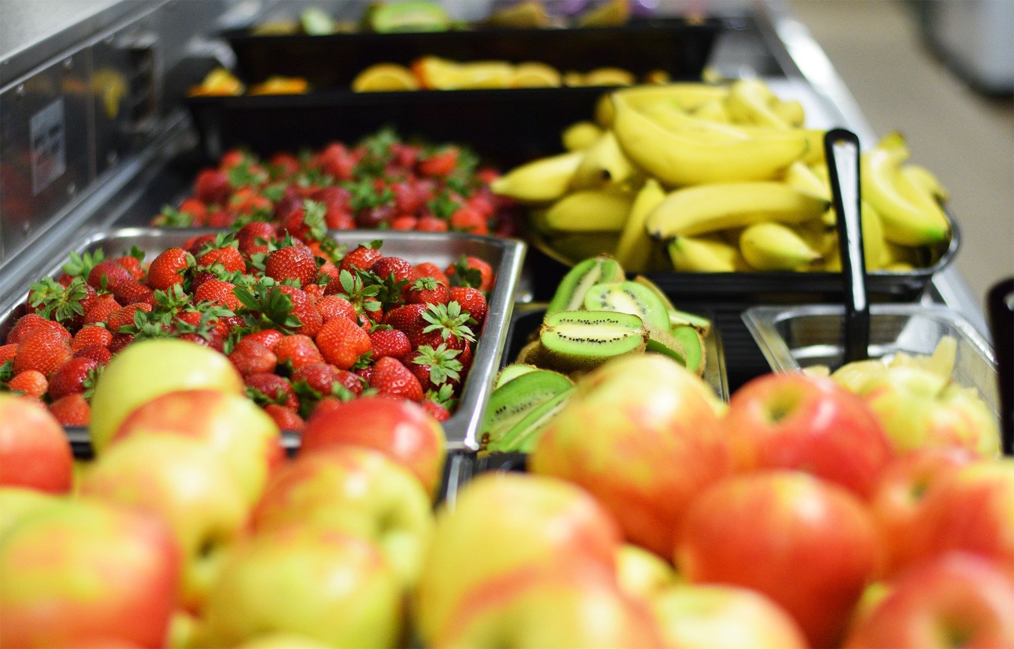 Prepared fresh fruit in the Viking Cafe, Holmen High School's cafeteria, awaits being transferred to the school salad bar, a popular choice among students and staff