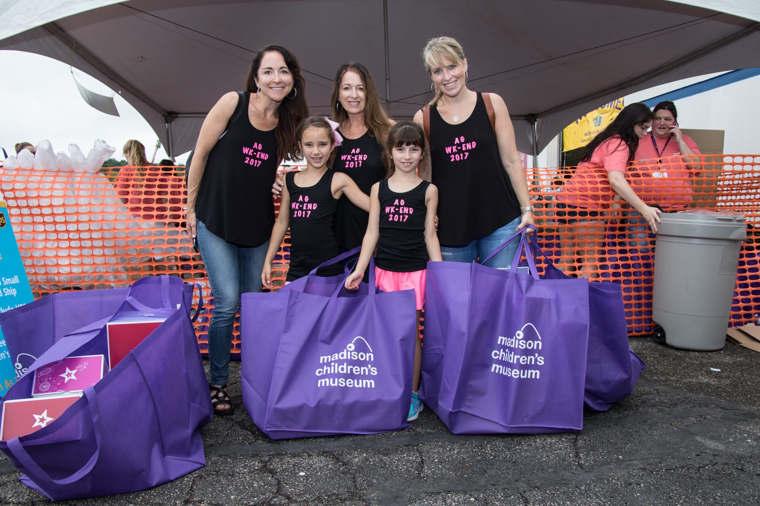 Fans wear custom shirts while shopping at the annual American Girl benefit.
