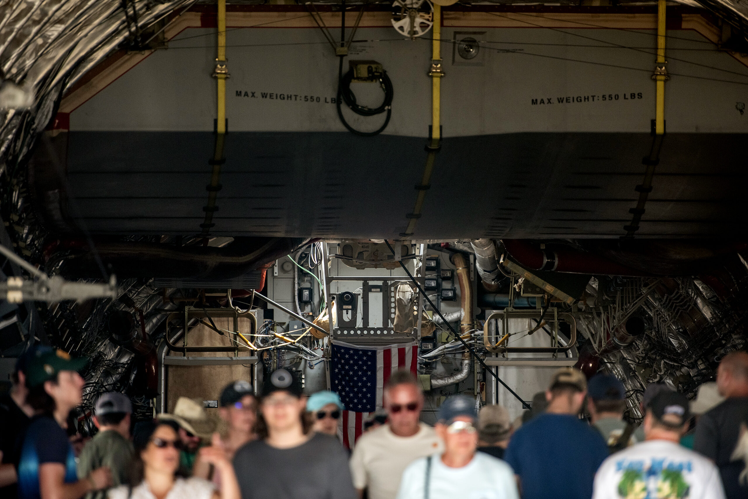 People walk inside of an airplane to see the inner workings.