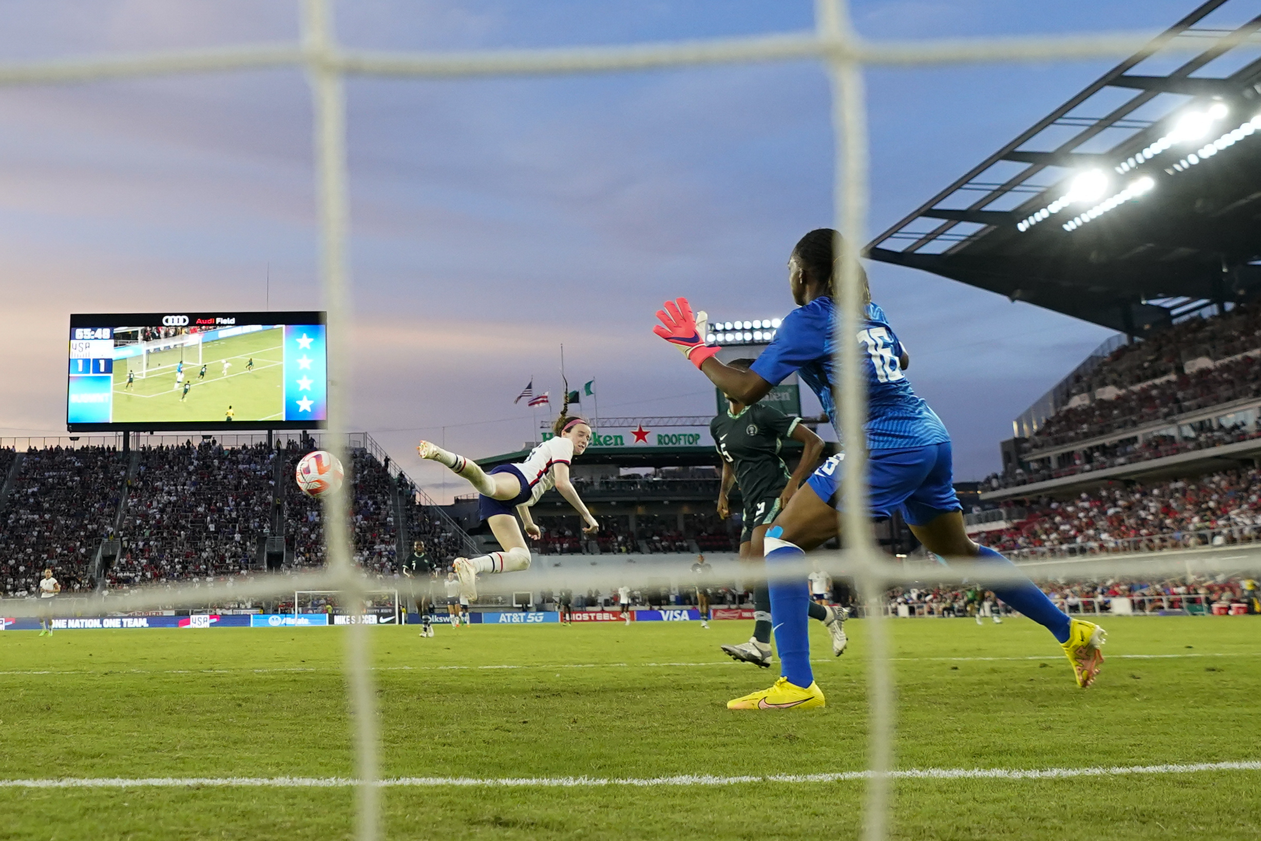 United States' Rose Lavelle connects on a header while scoring a goal.