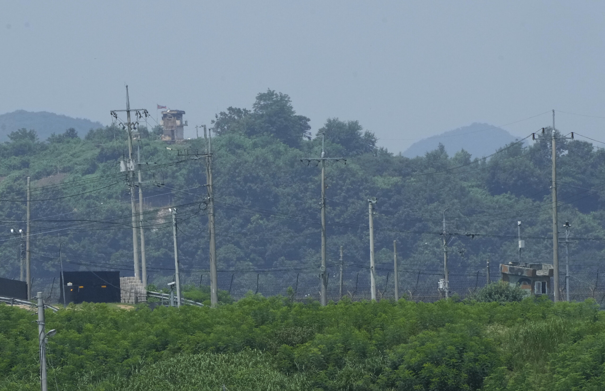 A North Korean military guard post, top left, and South Korea post, bottom right, are seen in Paju near the border with North Korea, South Korea, Wednesday, July 19, 2023