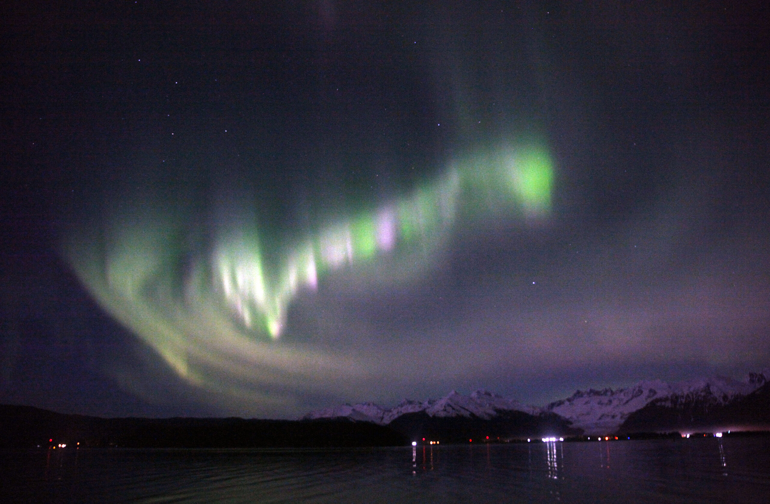The night sky during aurora borealis in Alaska